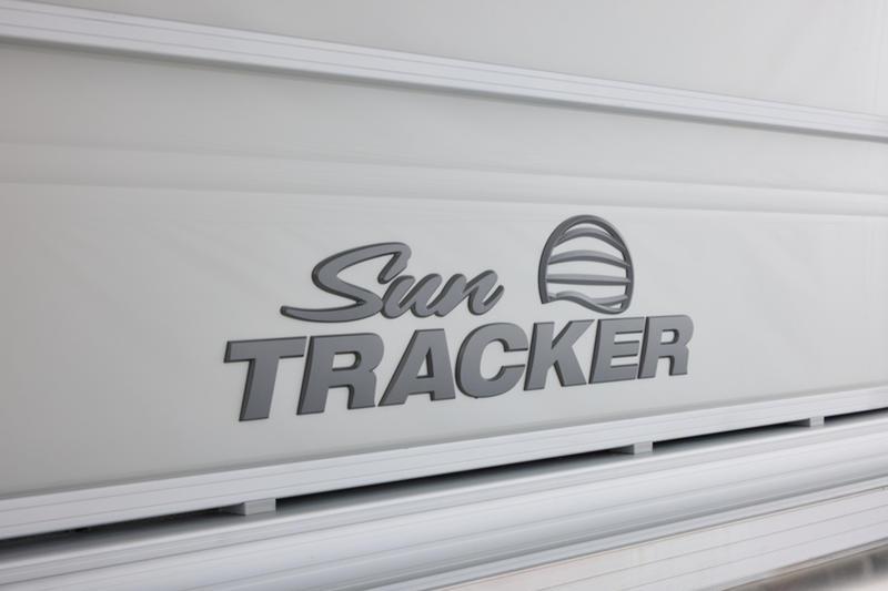 Sun Tracker Party Barge 22 DLX 2026 logo on boat exterior.
