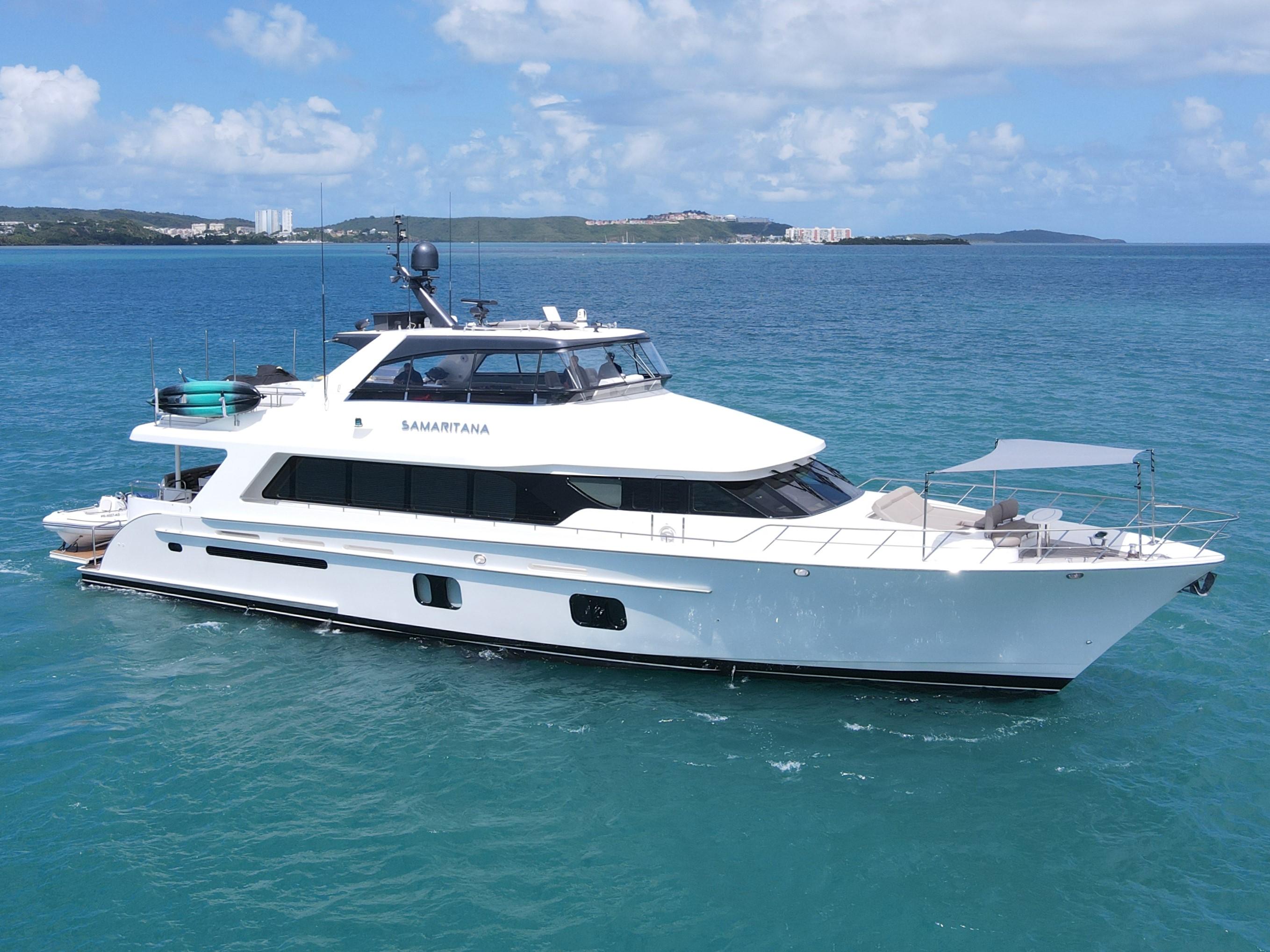 2013 Cheoy Lee Bravo yacht cruising on clear blue waters under a sunny sky.