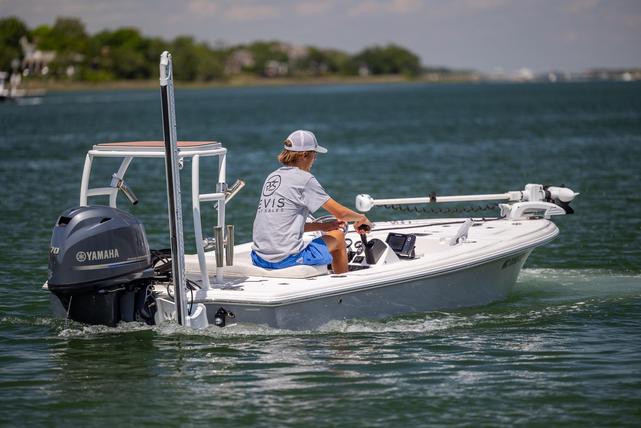 2018 Bomb Island 160 SC boat with Yamaha engine on a calm lake.