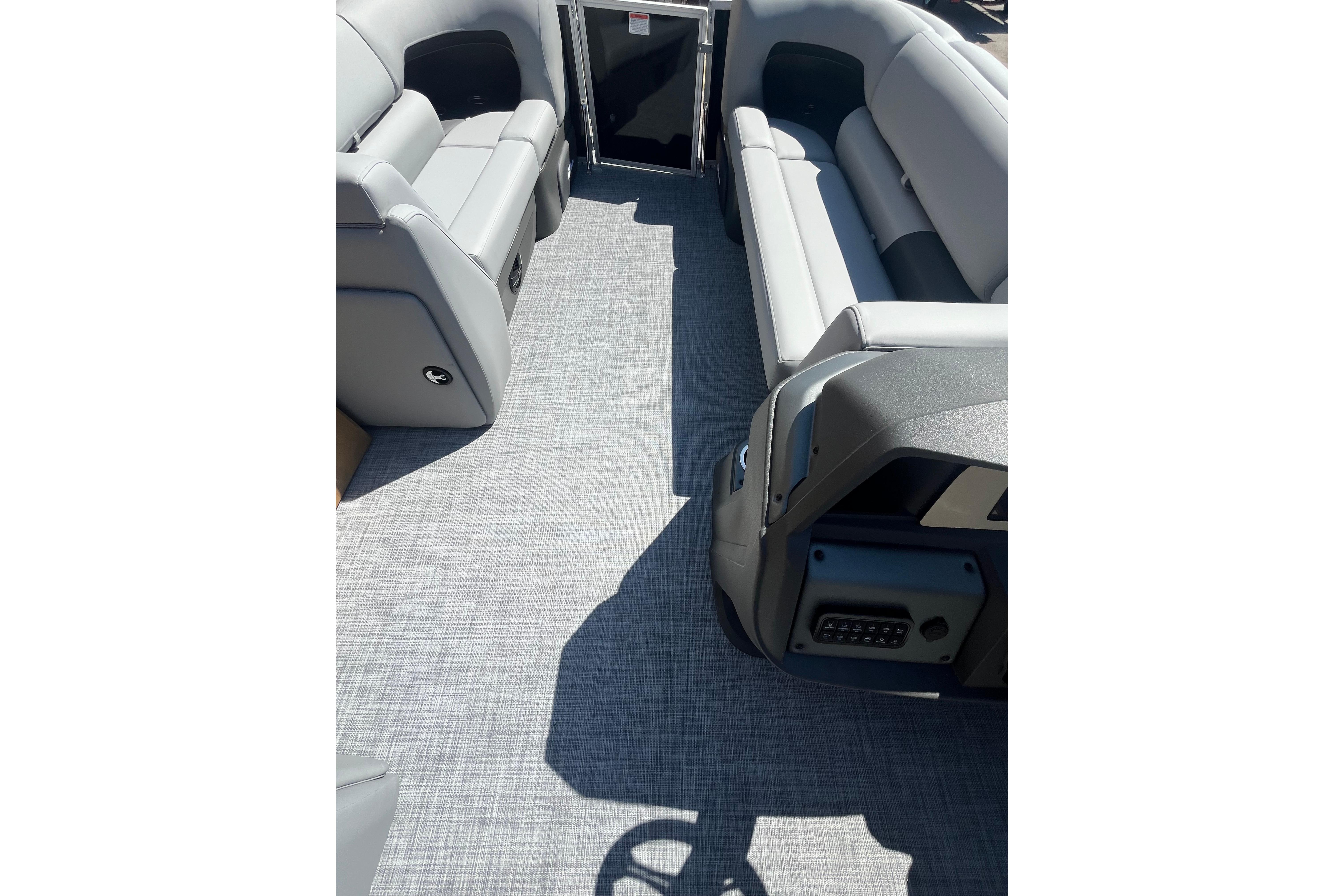 Interior of 2026 Sun Tracker Party Barge 20 DLX with gray seating and flooring.
