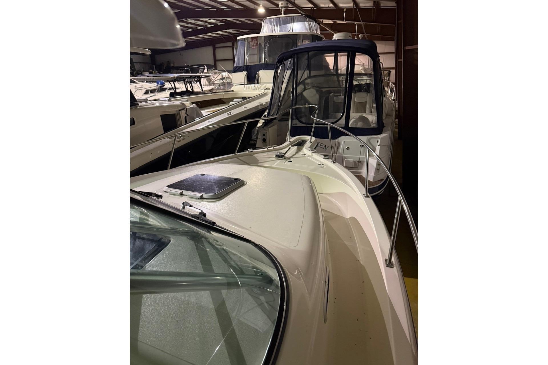 2000 Pursuit 3070 Offshore Center Console boat in indoor storage facility.