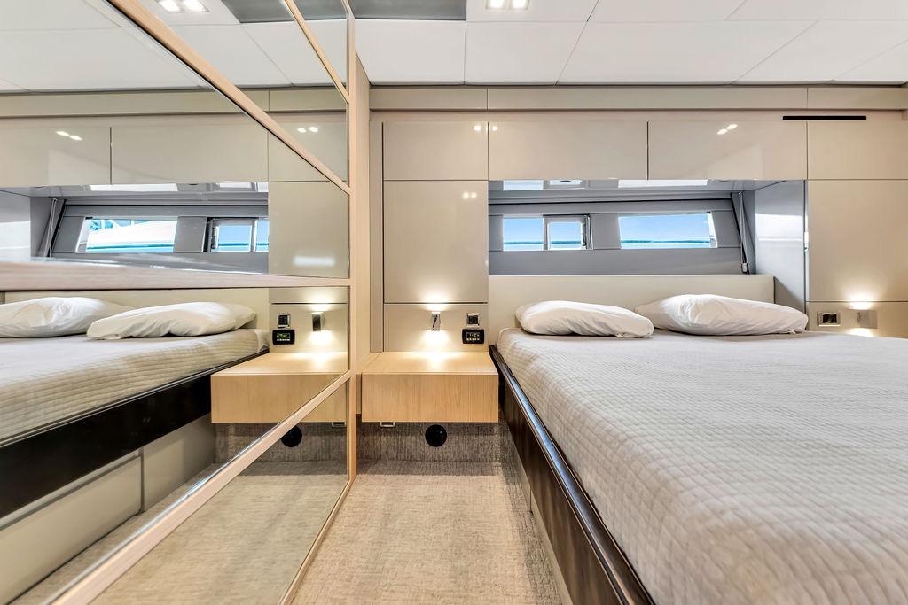 Luxurious bedroom interior of 2012 Fairline Targa 58 yacht with modern design elements.