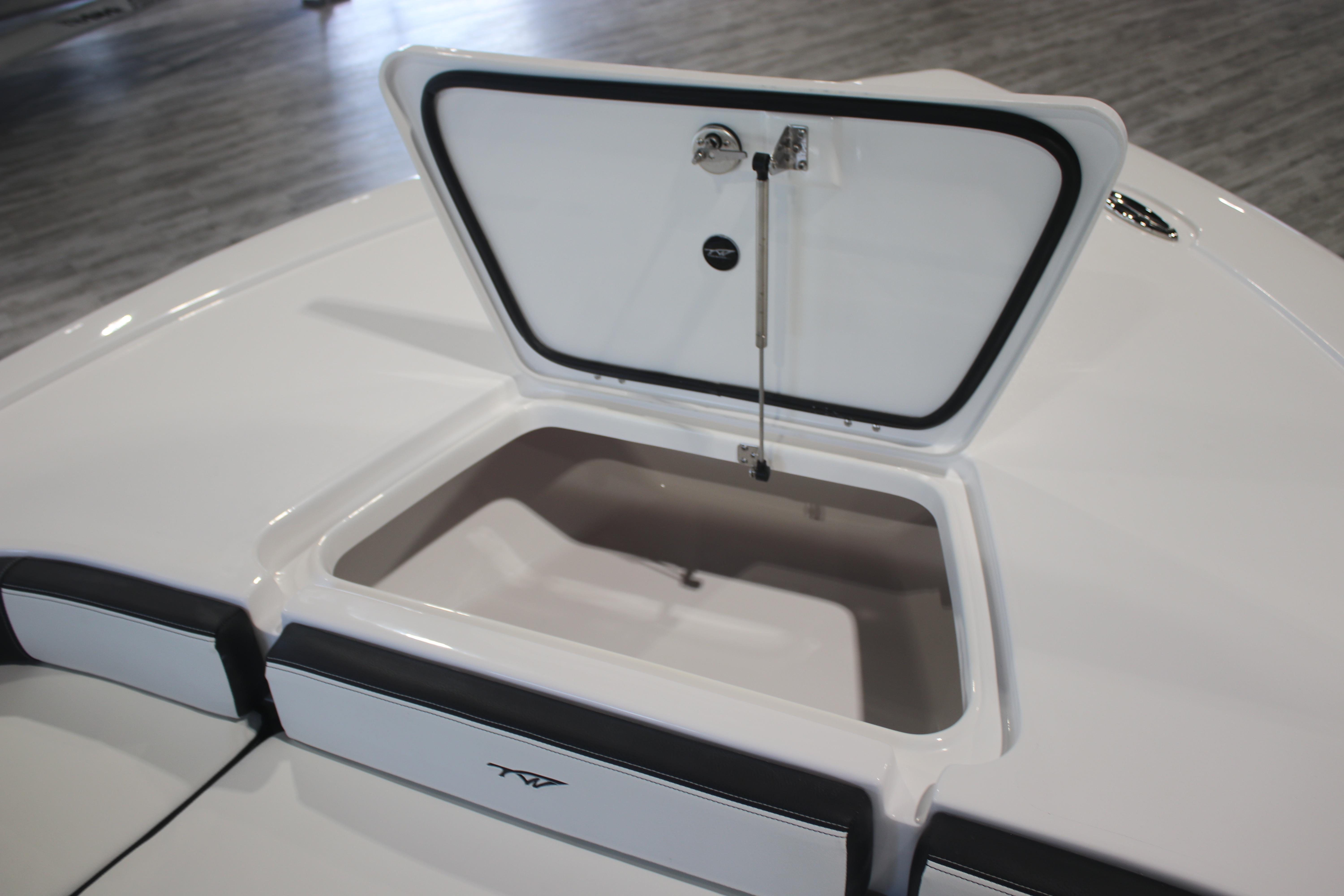 Open storage compartment on 2026 Tidewater 2300 Carolina Bay boat.