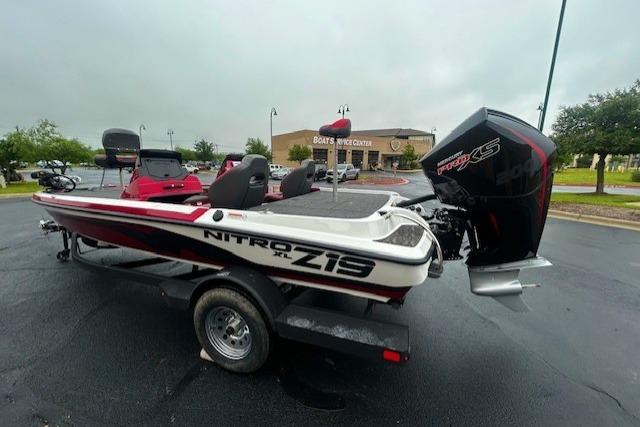 2026 Nitro Z19 XL boat with powerful engine, parked outdoors on a cloudy day.