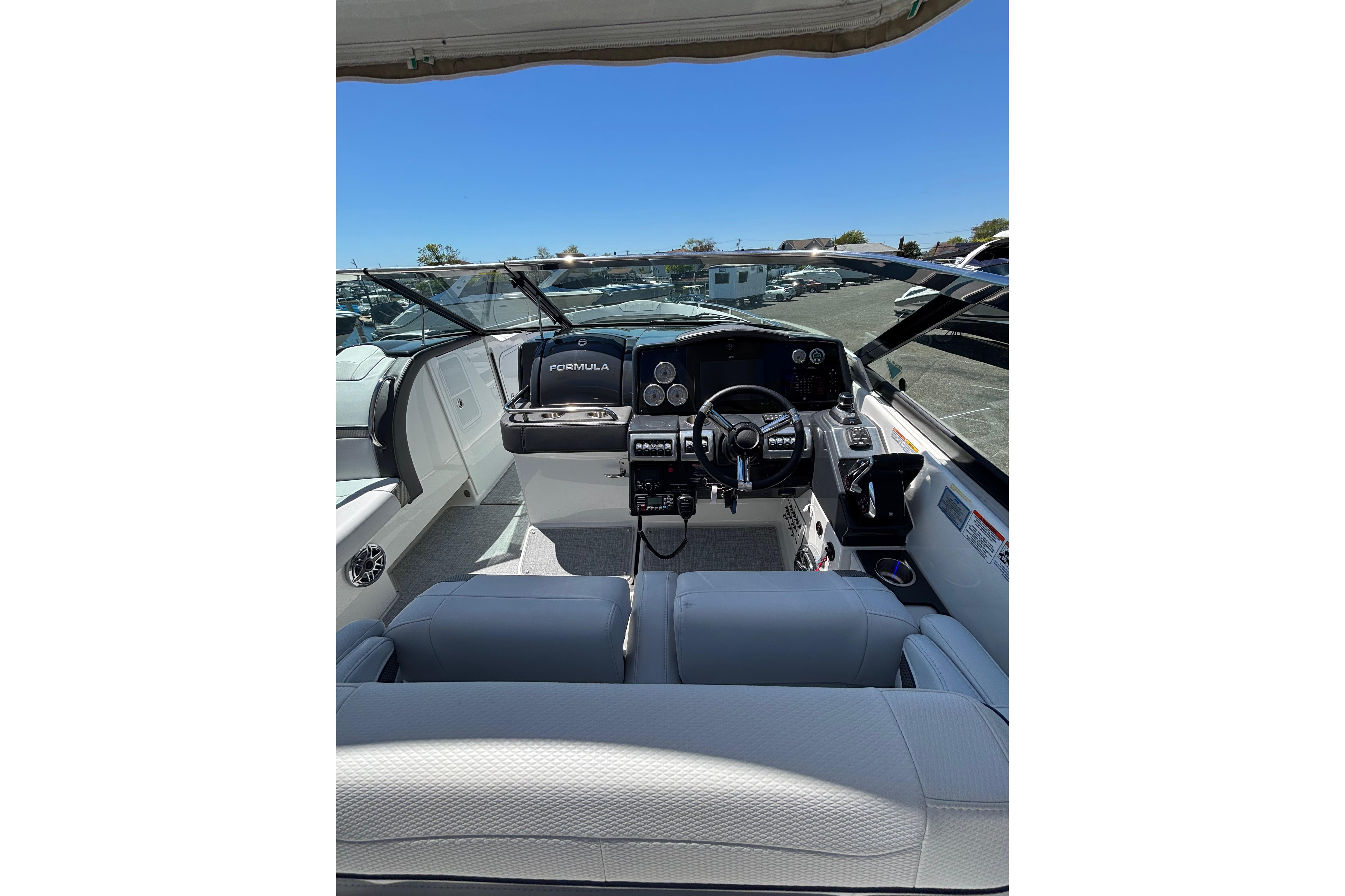 2023 Formula 350 Crossover Bowrider OB cockpit with modern controls and seating.