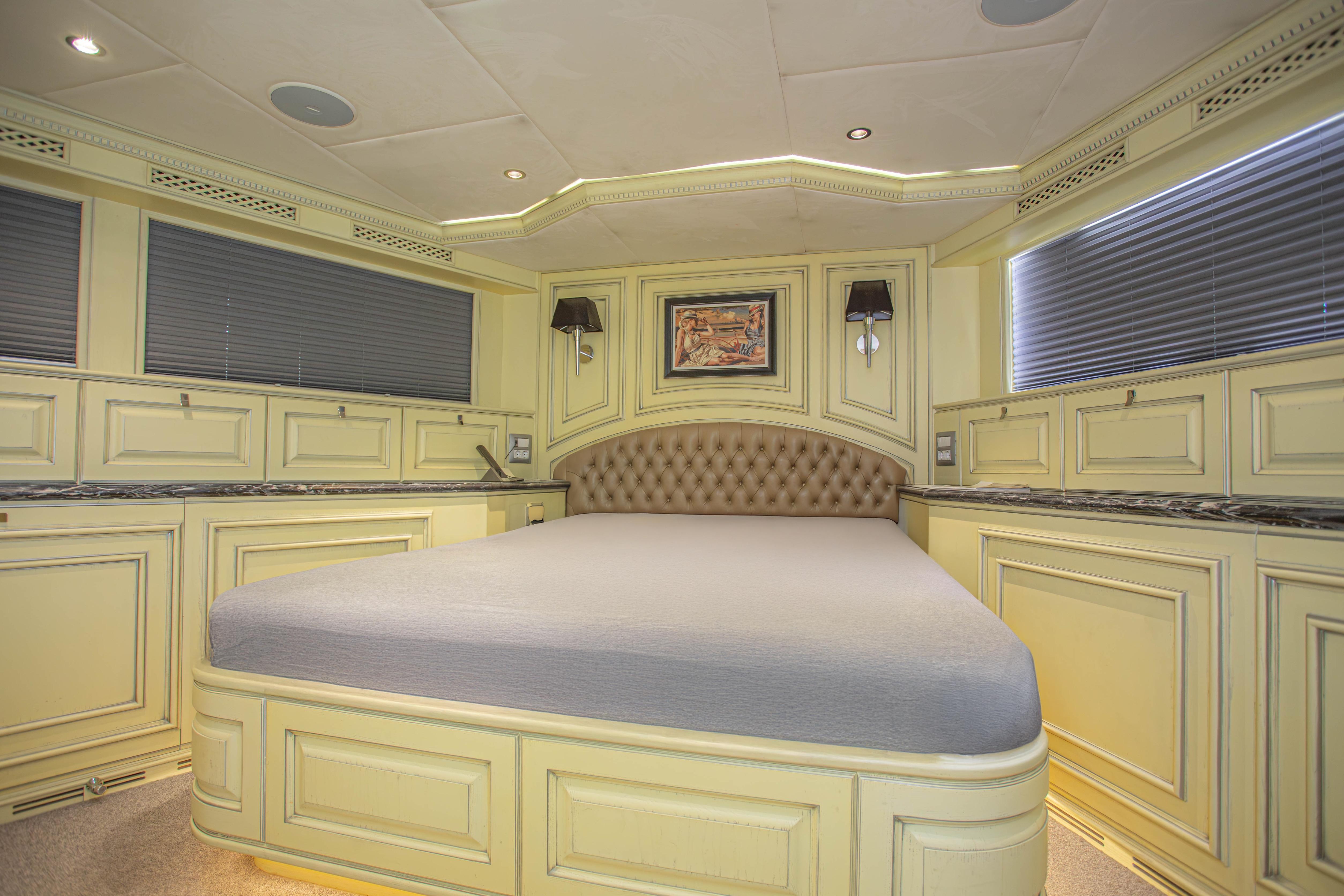Luxurious bedroom interior of 2014 Fifth Ocean Yachts 24m Displacement Explorer Yacht.