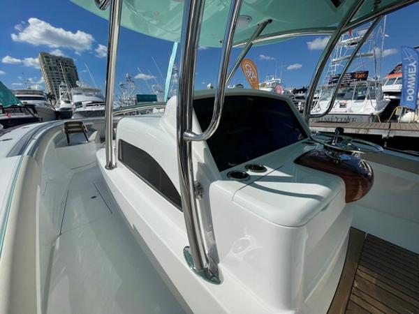 2025 Mag Bay 43 Center Console boat at a marina, showcasing sleek design and modern features.