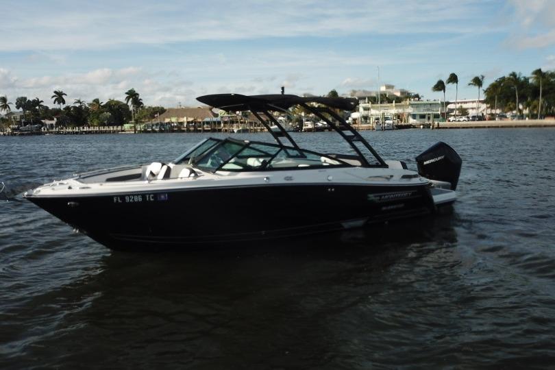 2022 Monterey 255SS Super Sport boat on water, with palm trees in the background.