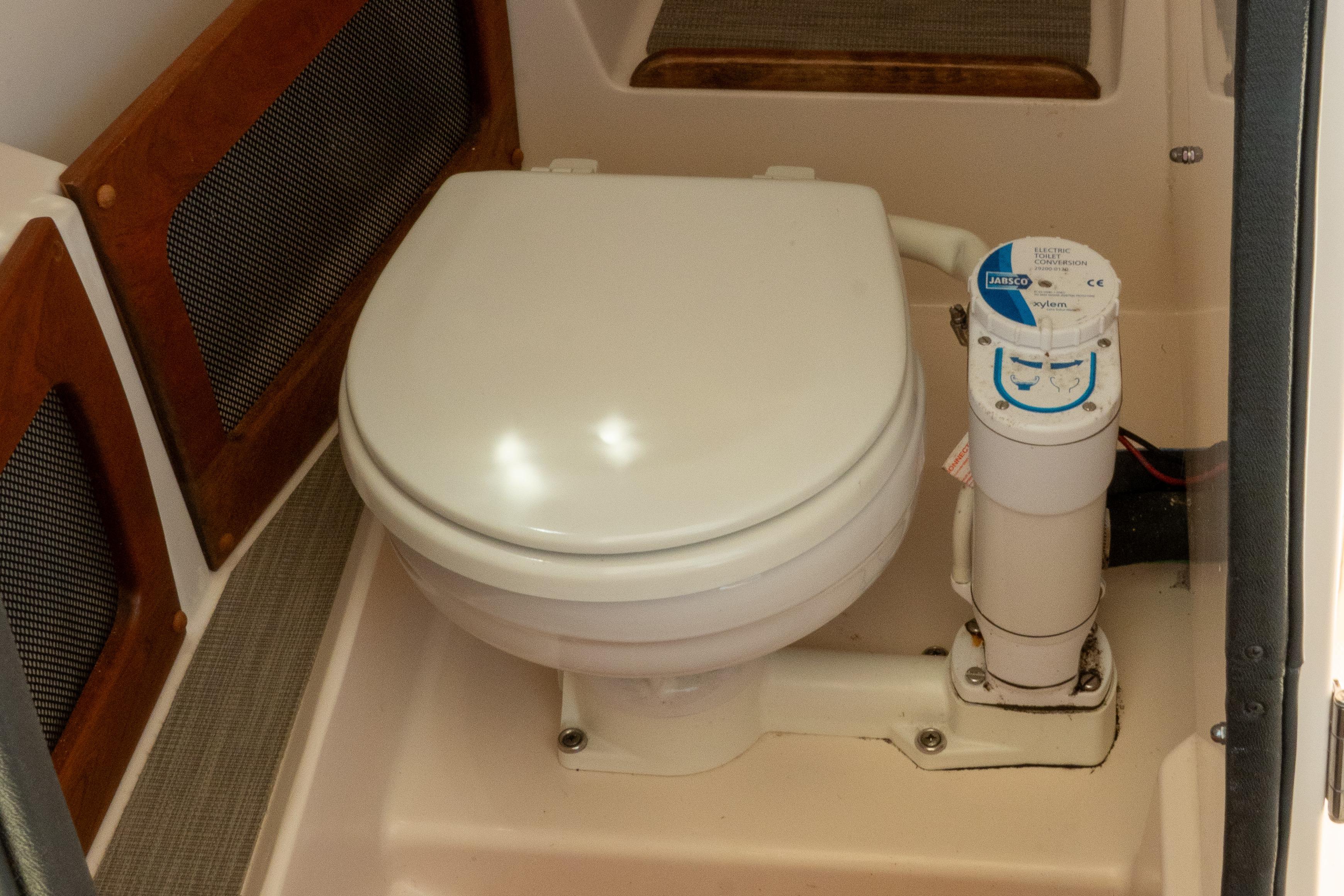 2022 Grady-White Freedom 235 boat toilet with Jabsco electric flush system.