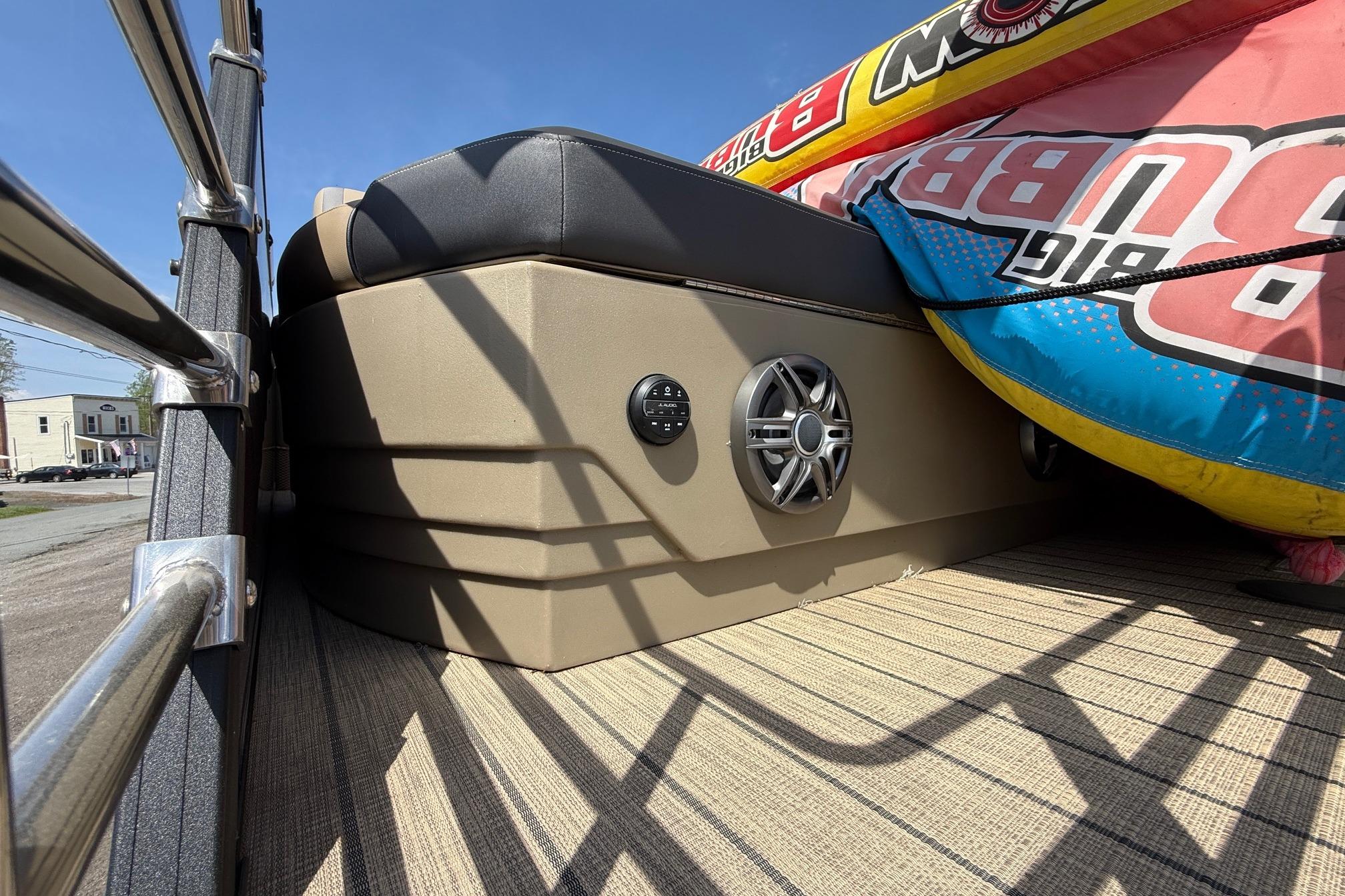2024 Sylvan X1 CLZ DH boat interior with speaker and inflatable tube on deck.