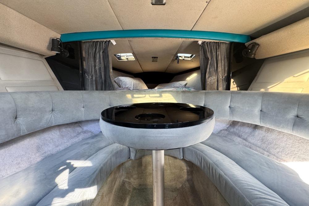 Interior of a 1989 Formula 292 SR-1 boat with plush seating and a central table.