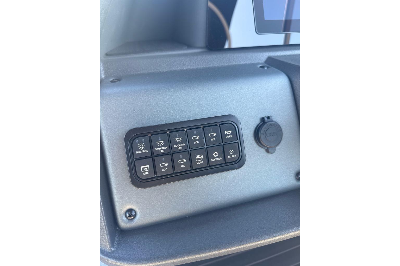 Control panel of 2026 Sun Tracker Party Barge 20 DLX with labeled buttons.