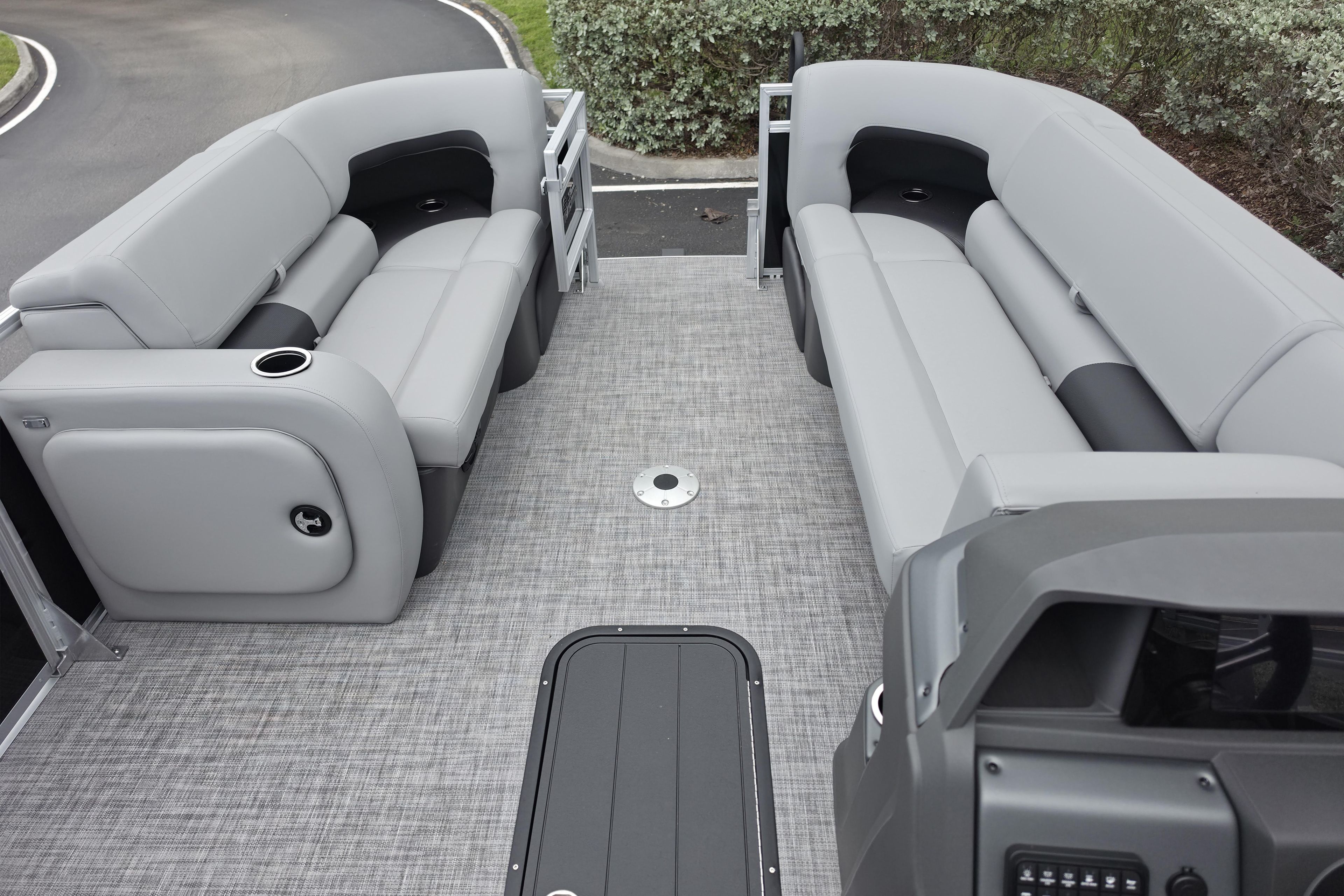 2026 Sun Tracker SportFish 22 XP3 interior with gray seating and modern design.