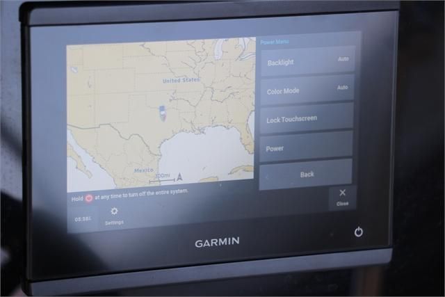 Garmin navigation system displaying a map and settings on a boat.