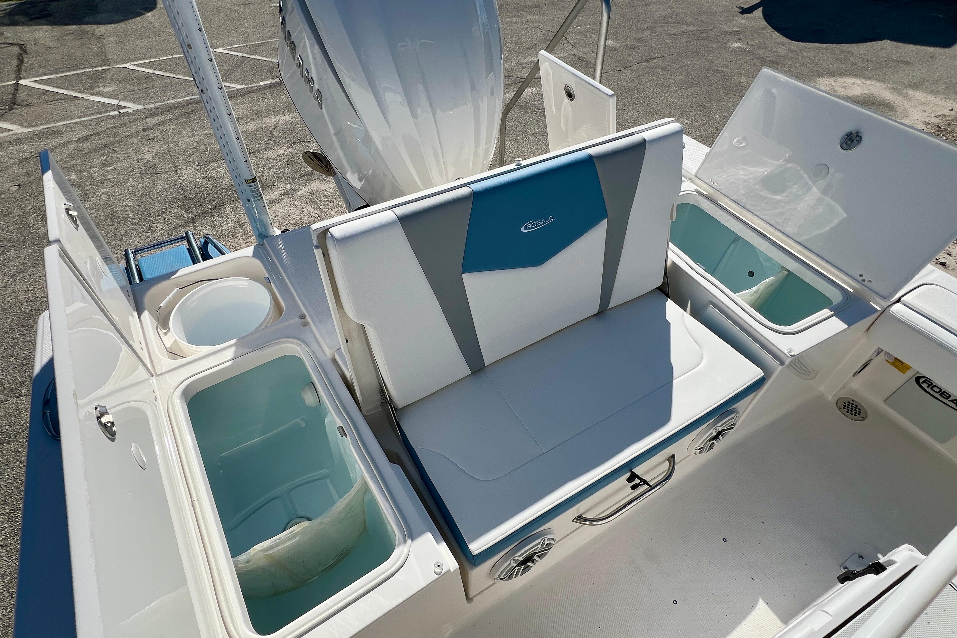 2026 Robalo 246 Cayman boat interior with seating and storage compartments.