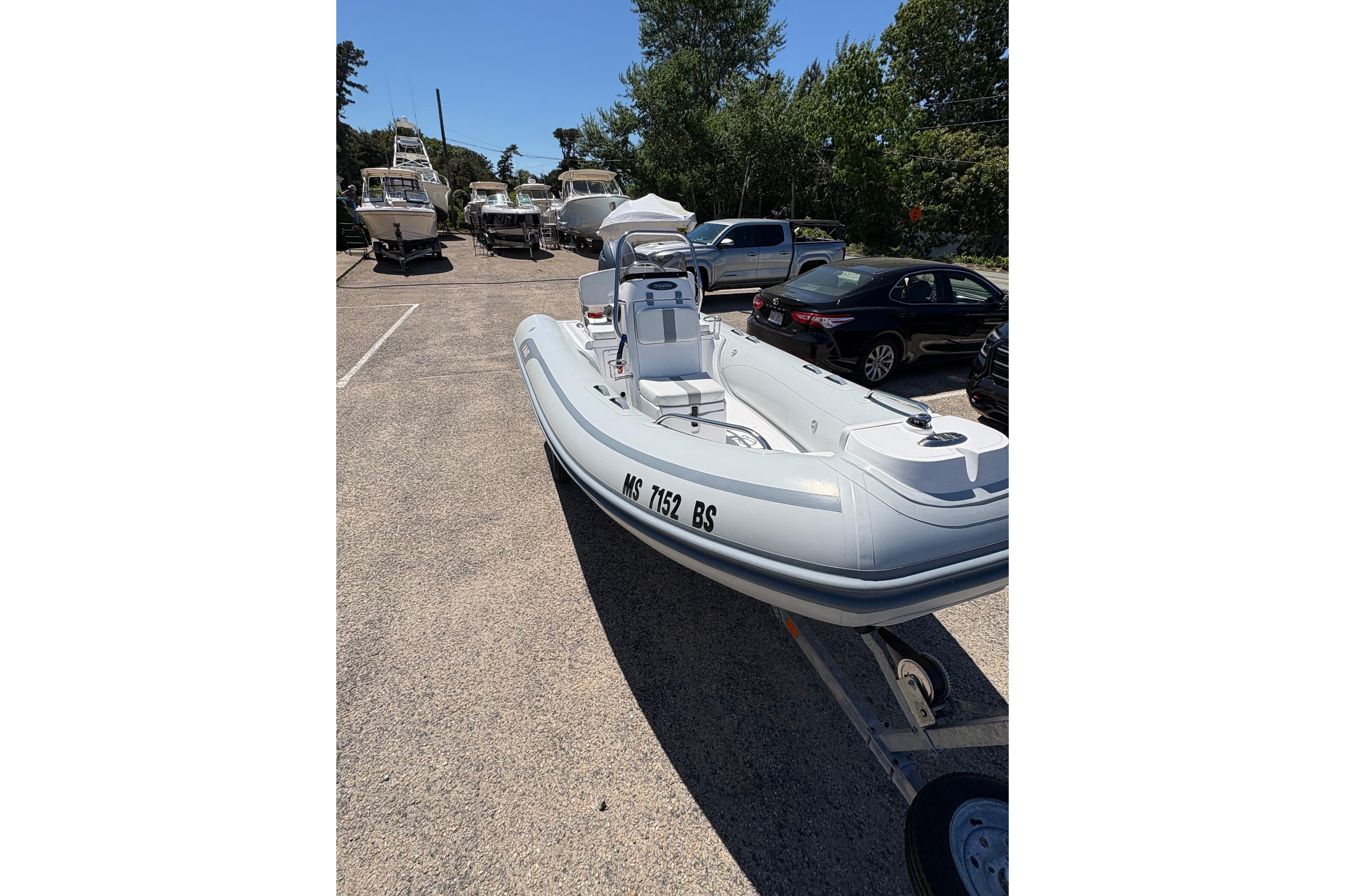 2022 AB Inflatables Oceanus 14 VST boat on trailer in parking lot.