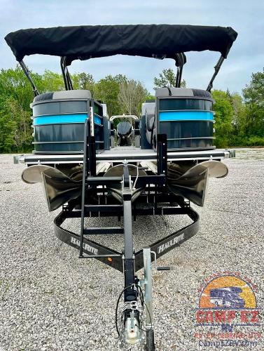 2024 Massimo Marine T-25 Ultra Lounger pontoon boat on a trailer.