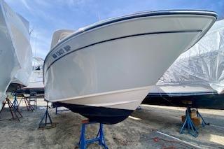 2017 Grady-White Freedom 255 boat on stands, viewed from the front.