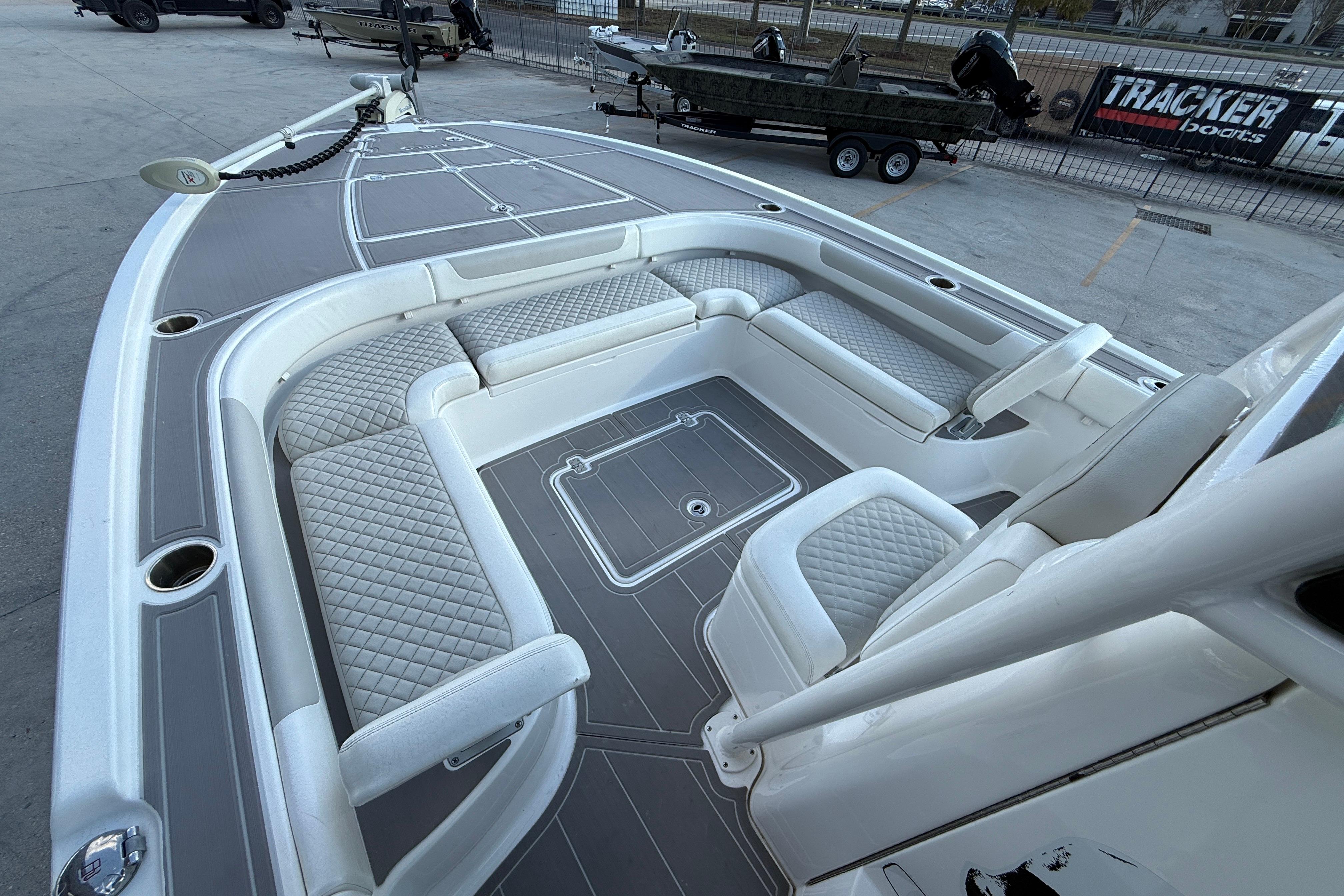 2022 Caymas 28 HB Twin boat interior with cushioned seating and steering console.
