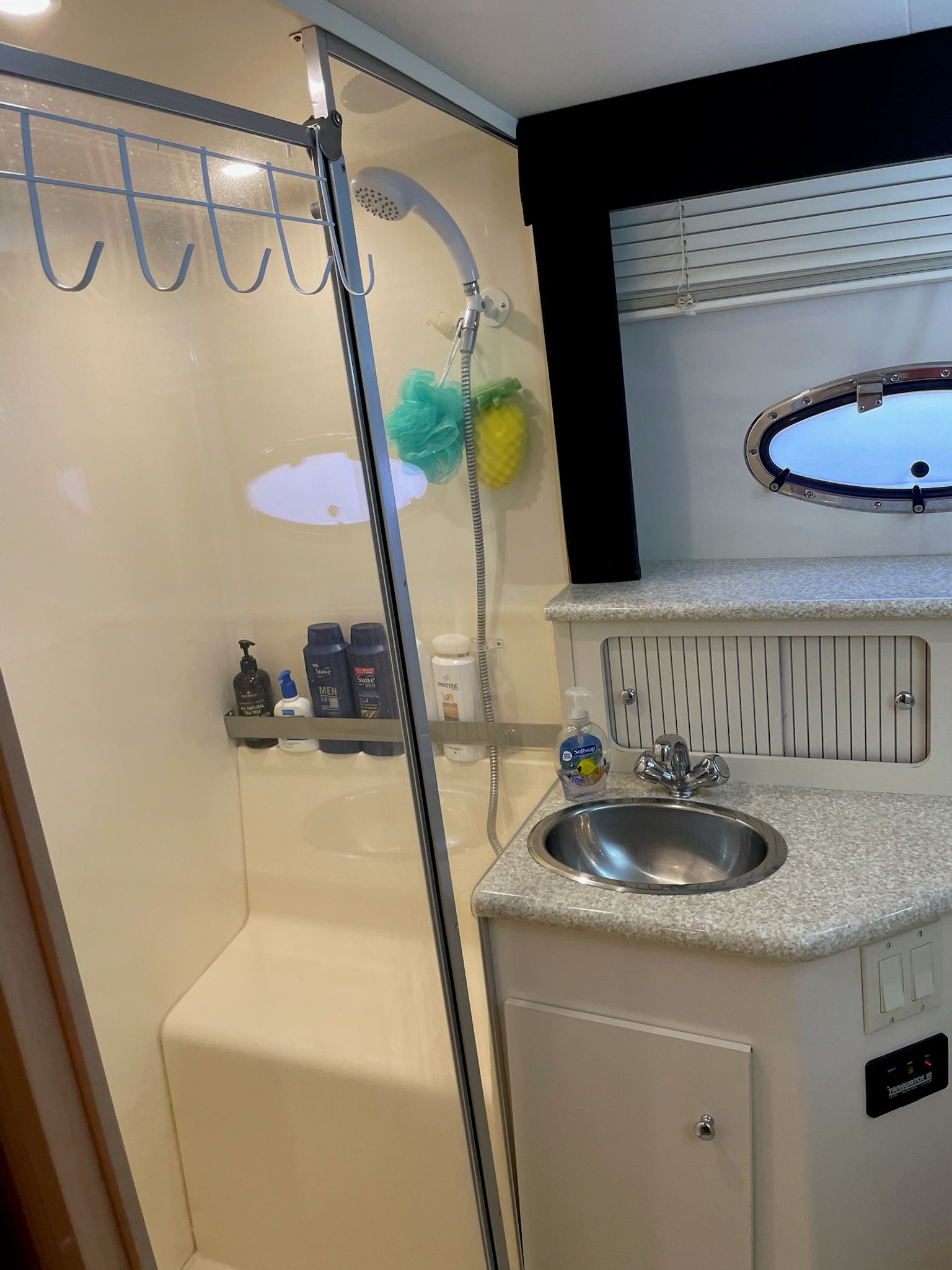 Bathroom of a Carver 356 yacht with shower and sink.