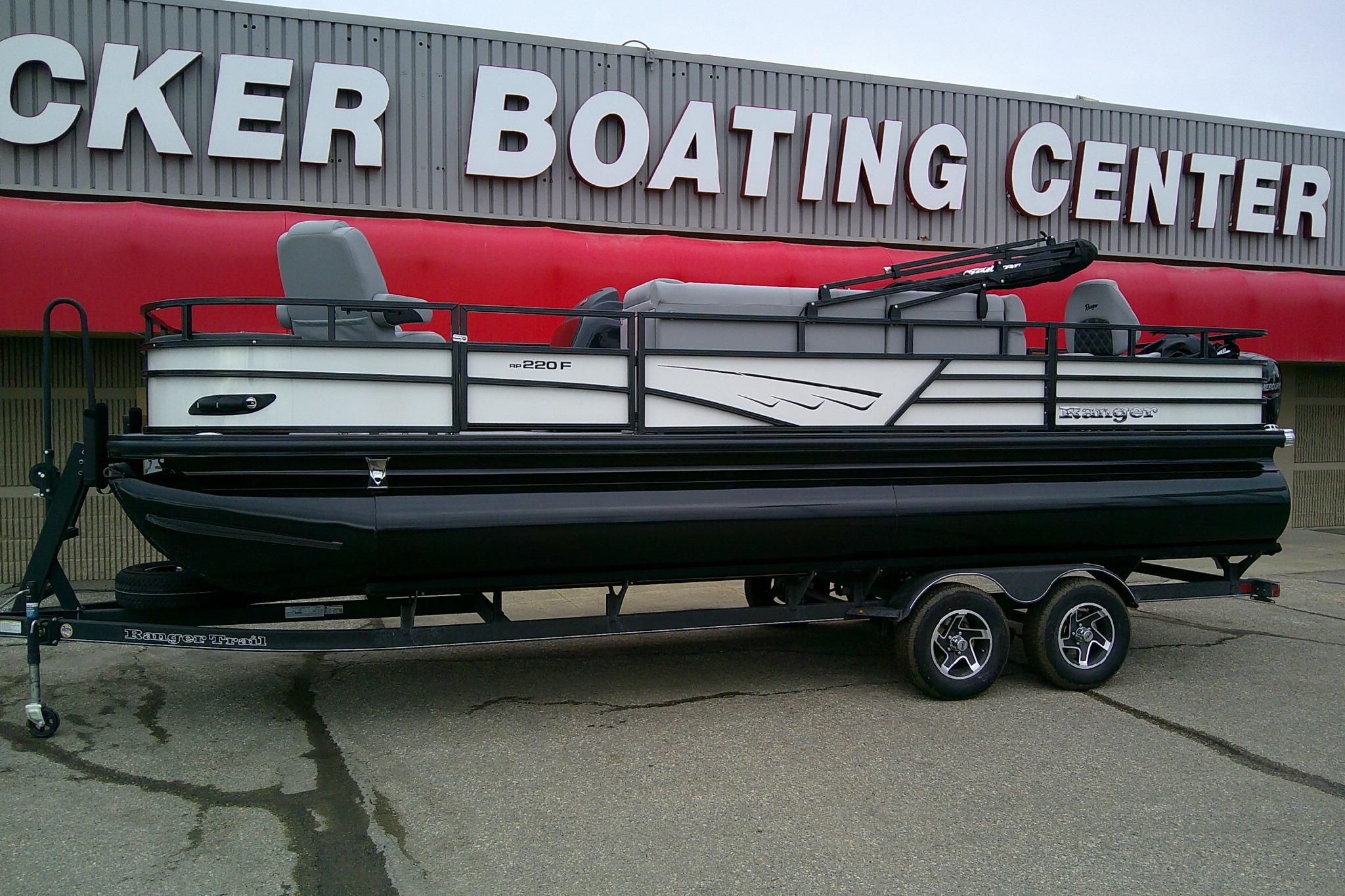 2026 Ranger 220F pontoon boat on trailer at boating center.