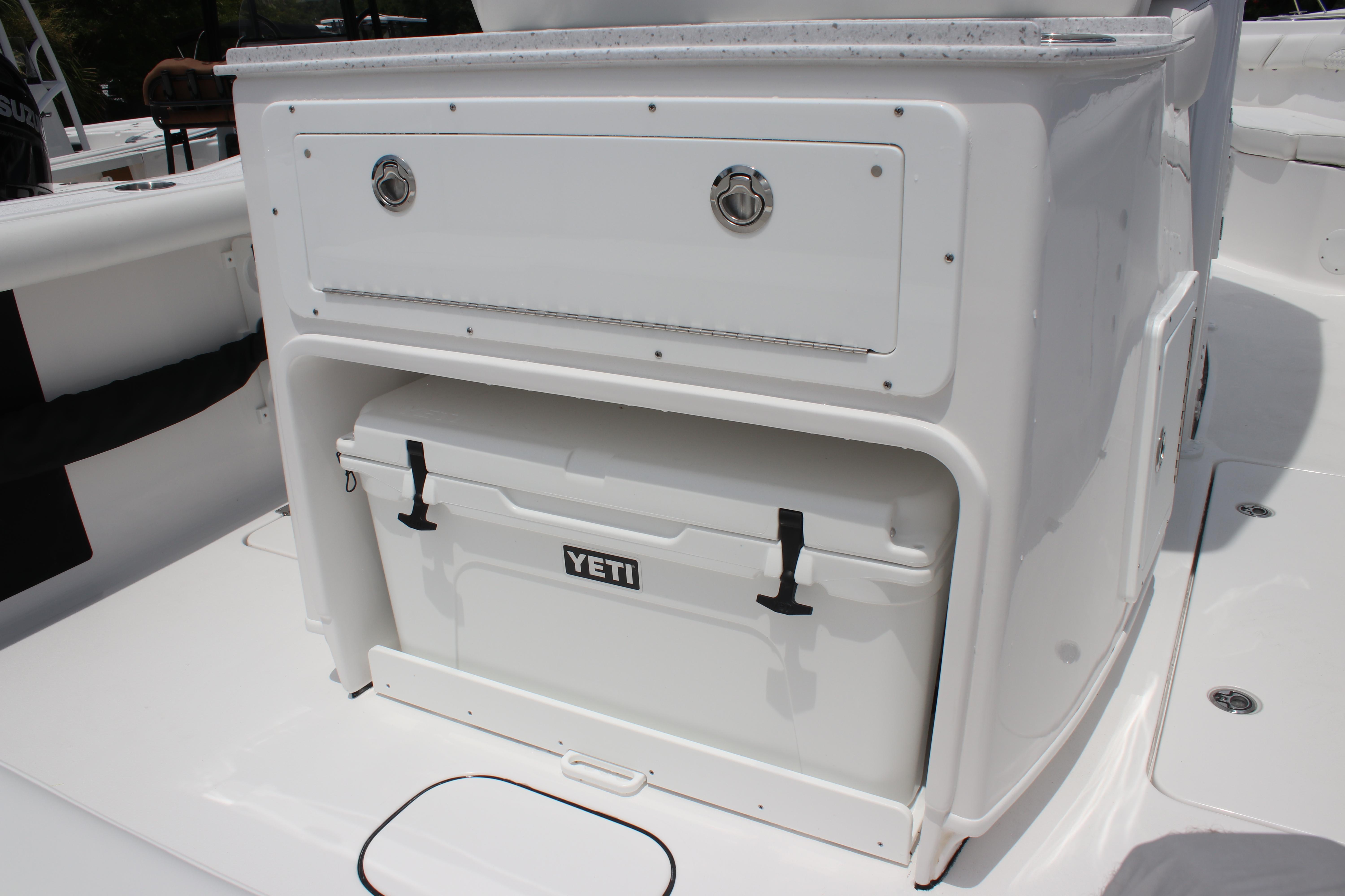 2026 Tidewater 272 LXF boat with Yeti cooler storage compartment.