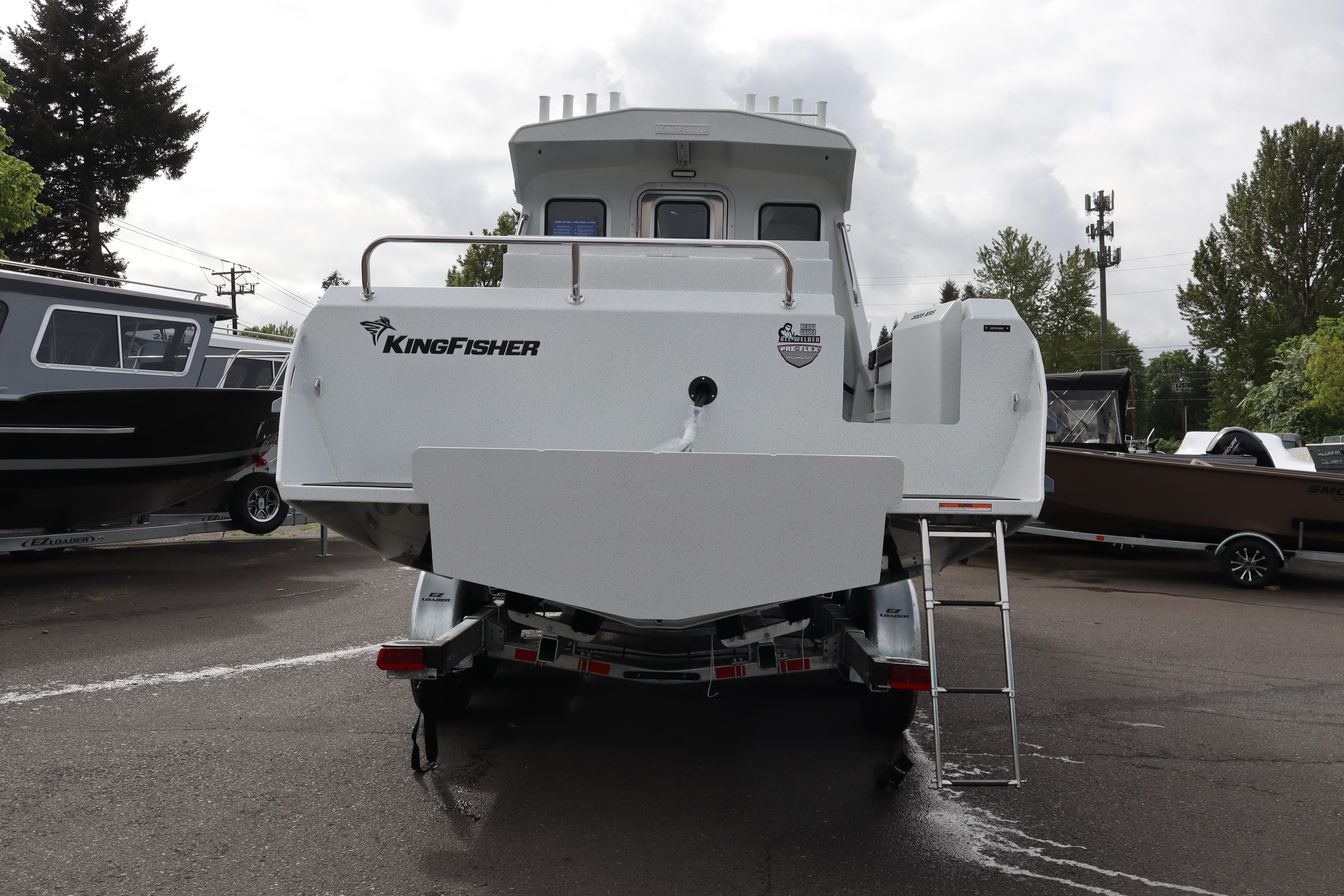 2026 KingFisher 3025 XRS boat rear view, parked on a trailer in a lot.