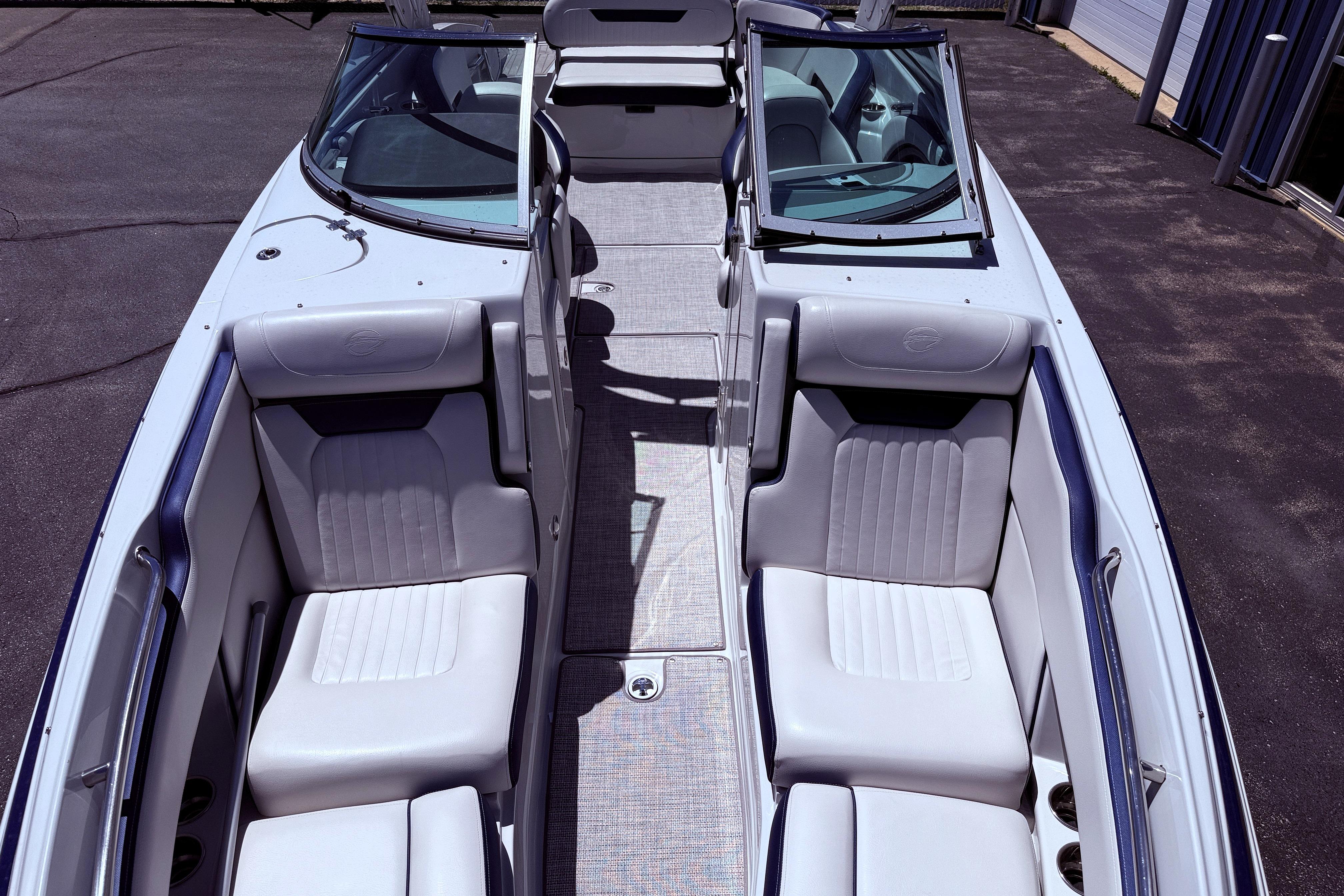 2025 Crownline 290 XSS boat interior with sleek seating and open windshield design.