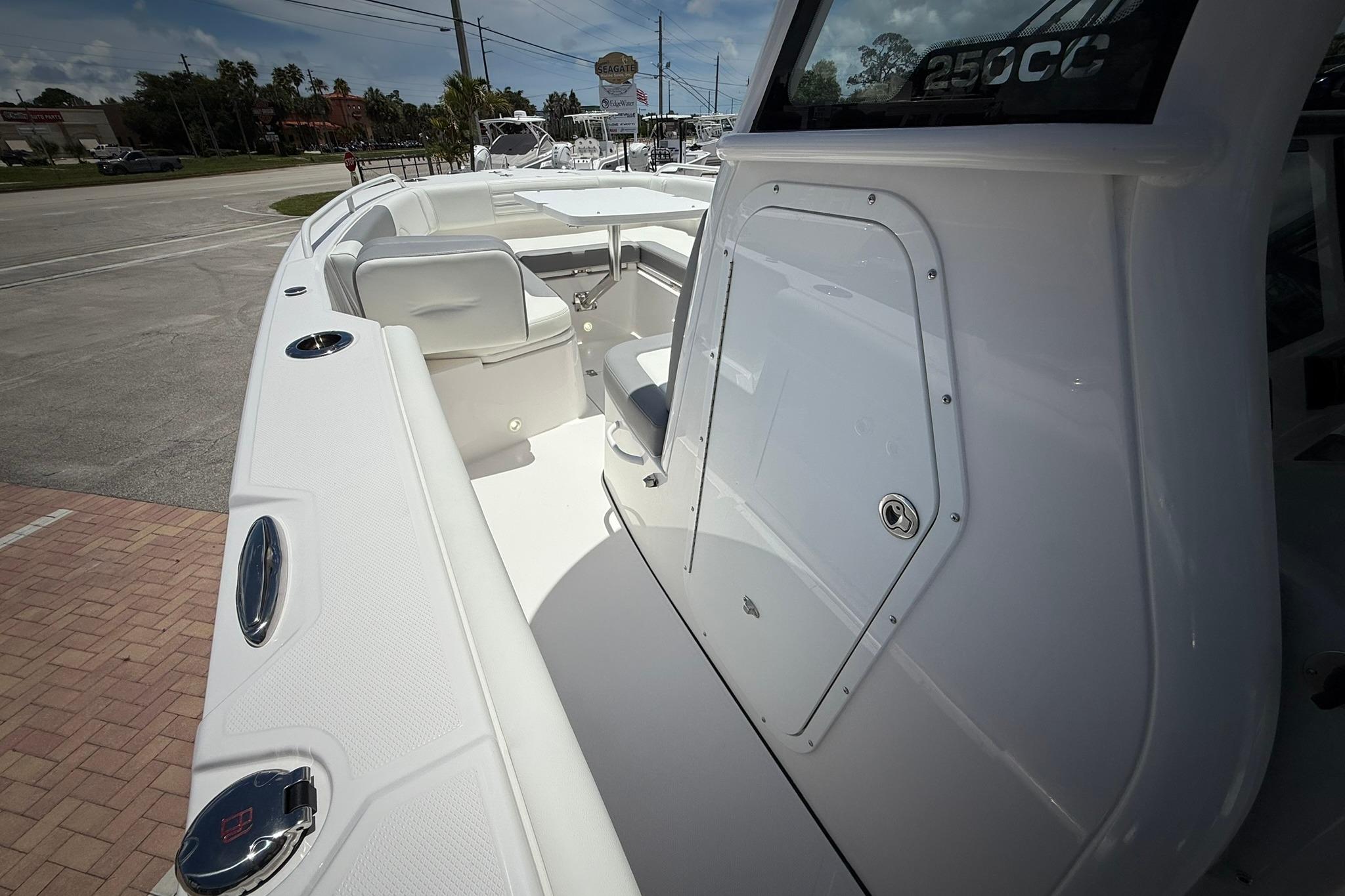 2026 Edgewater 250CC boat interior with seating and storage compartments.