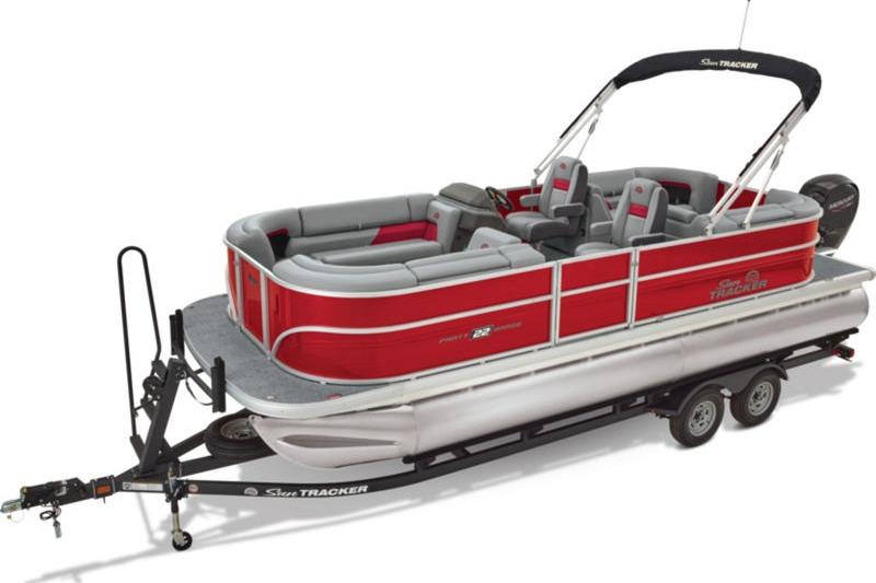 2026 Sun Tracker Party Barge 22 DLX pontoon boat on trailer, red and gray design.