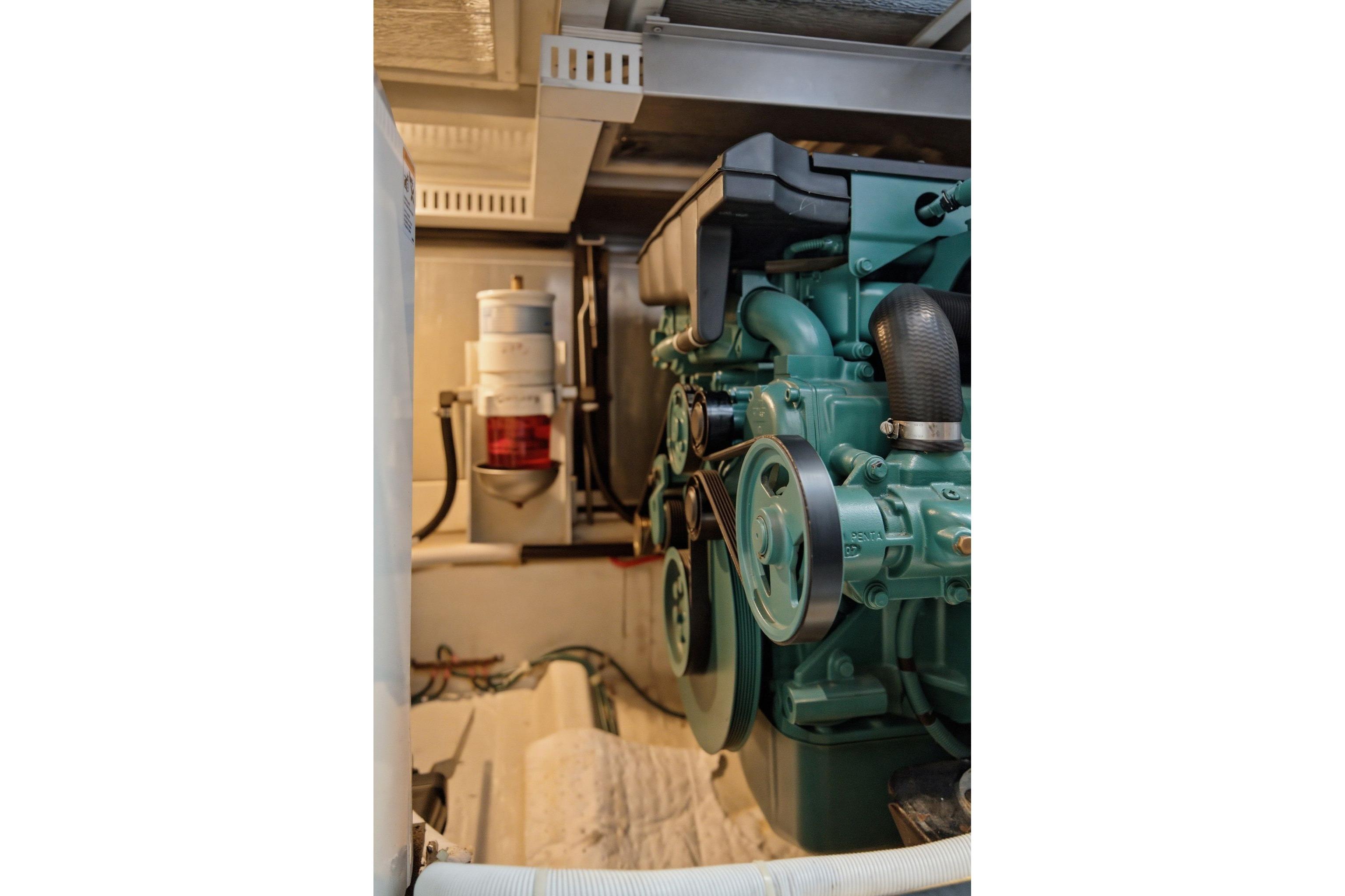 Engine room of 2005 Carver 39 Motor Yacht showcasing mechanical components.