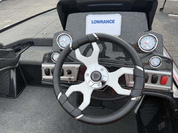 Steering wheel and dashboard of 2025 Nitro Z19 boat with Lowrance display.