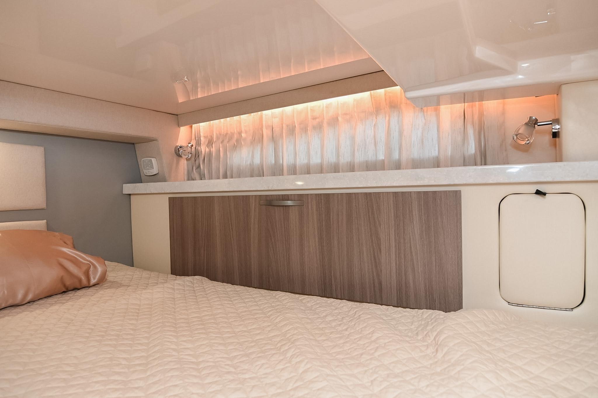 2021 Regal 33 Express cabin interior with modern lighting and wood accents.
