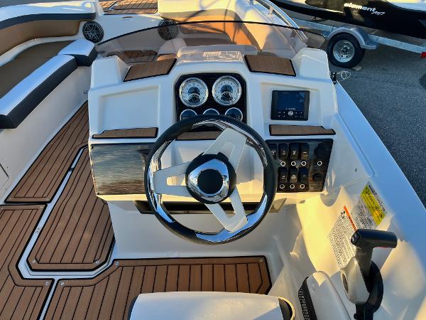 2024 Starcraft SVX 191 boat dashboard with steering wheel and control panel.