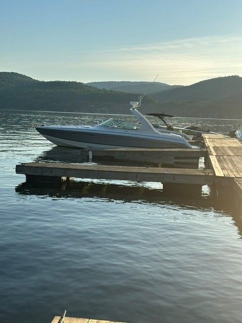 2006 Formula 330 Sun Sport boat docked at sunset.
