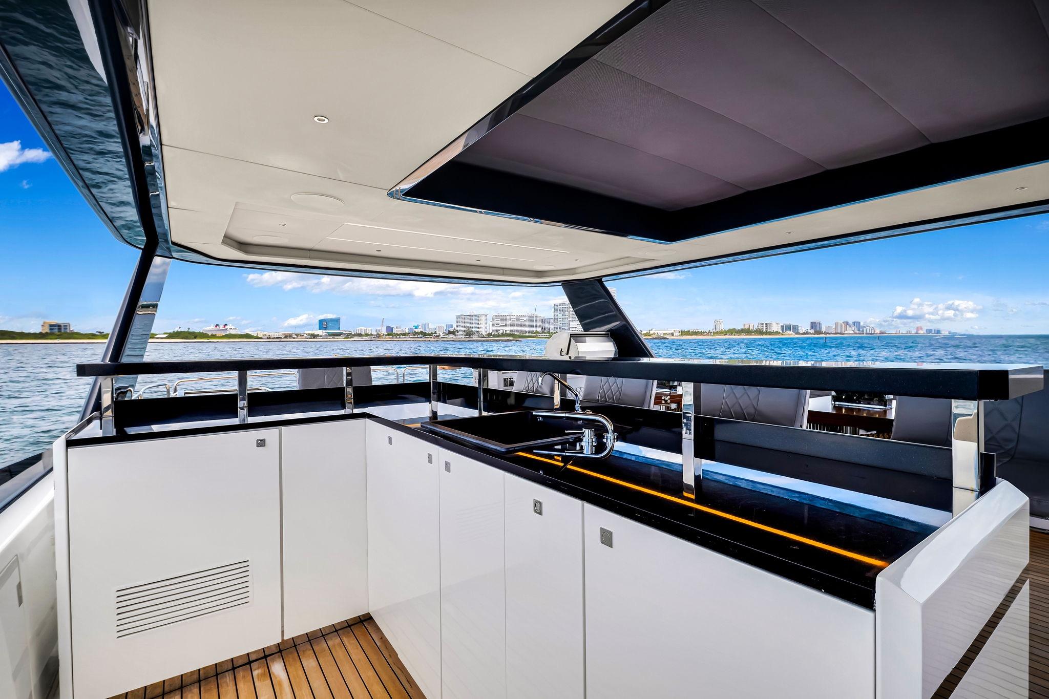 Luxurious 2021 Sirena 88 yacht interior with modern kitchen and ocean view.