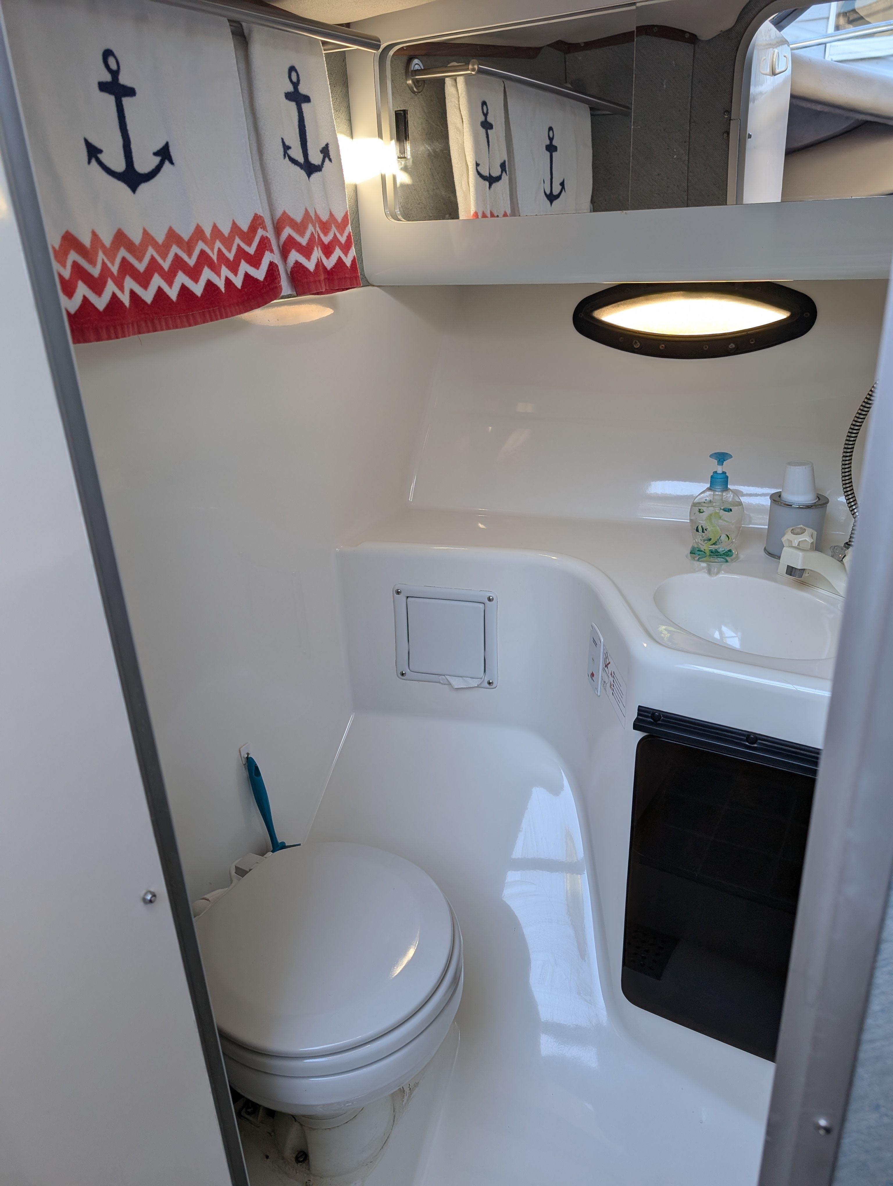 Bathroom in a 1991 Bayliner 3058 with toilet and sink.