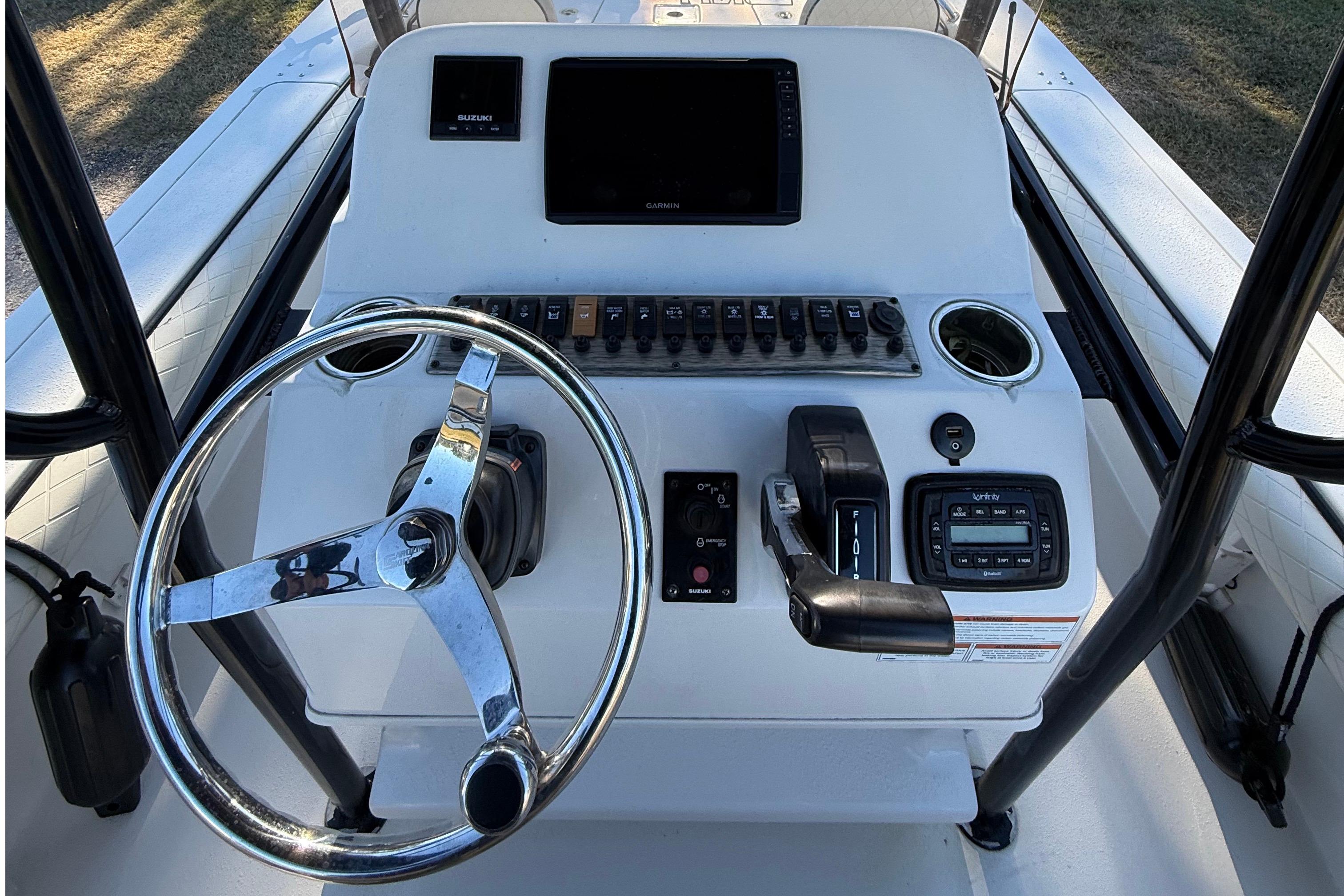 2021 Carolina Skiff 26 Ultra Elite boat console with steering wheel and controls.