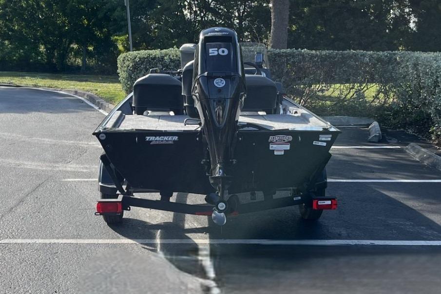 2026 Tracker Bass Tracker Classic XL boat with 50HP engine in parking lot.
