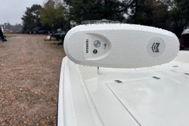 2026 Mako Pro Skiff 17 CC boat with Minn Kota Terrova motor, wet from rain.