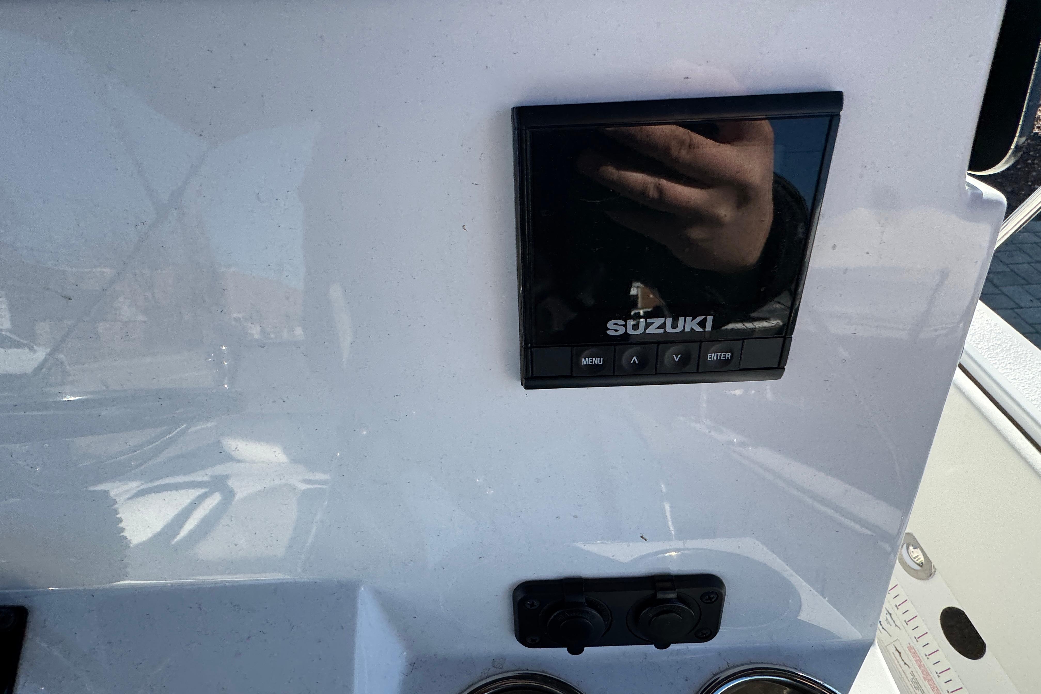 Suzuki control panel on 2025 Stingray 173 CC boat dashboard.