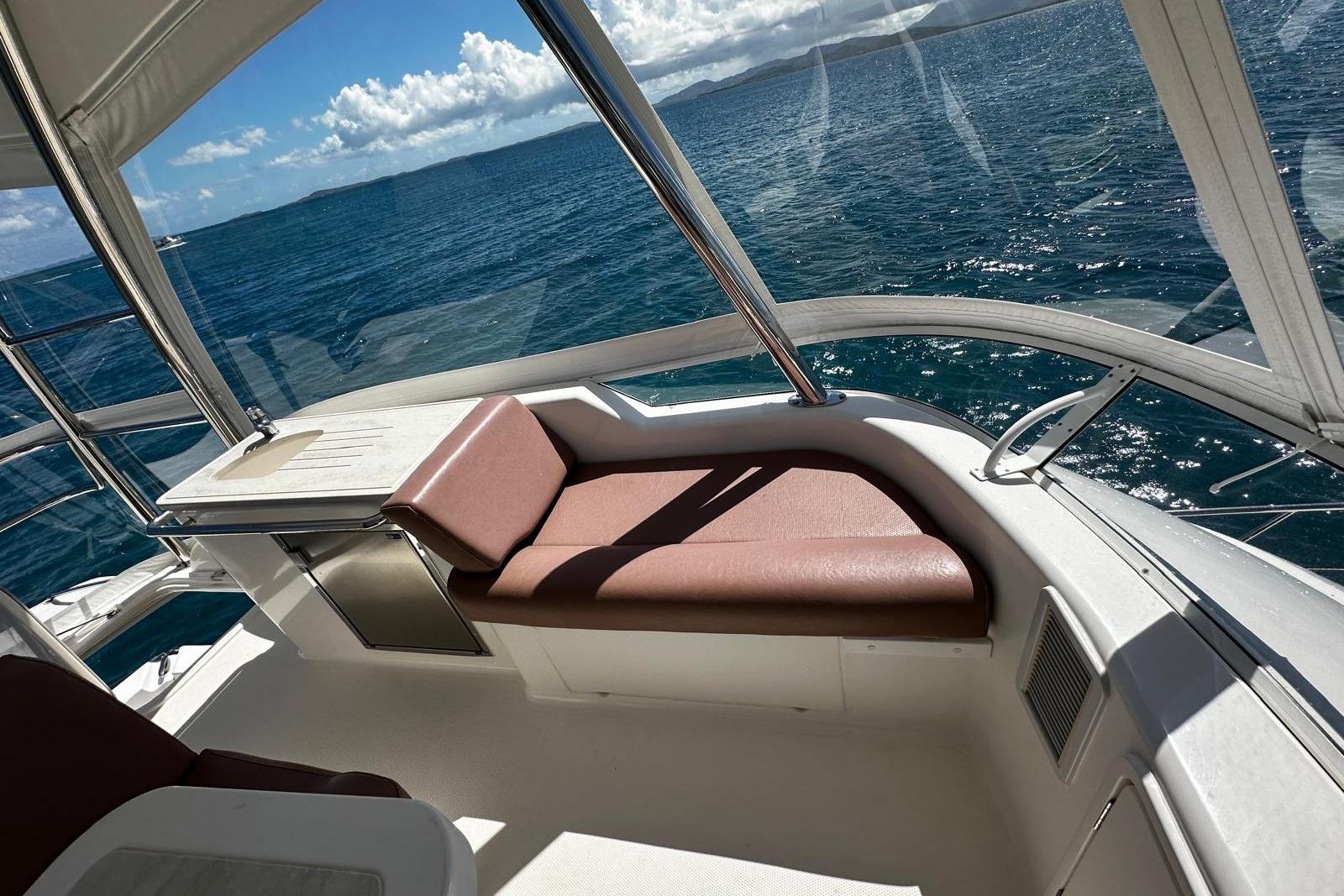 2012 Riviera 43 Flybridge yacht interior with ocean view and comfortable seating.