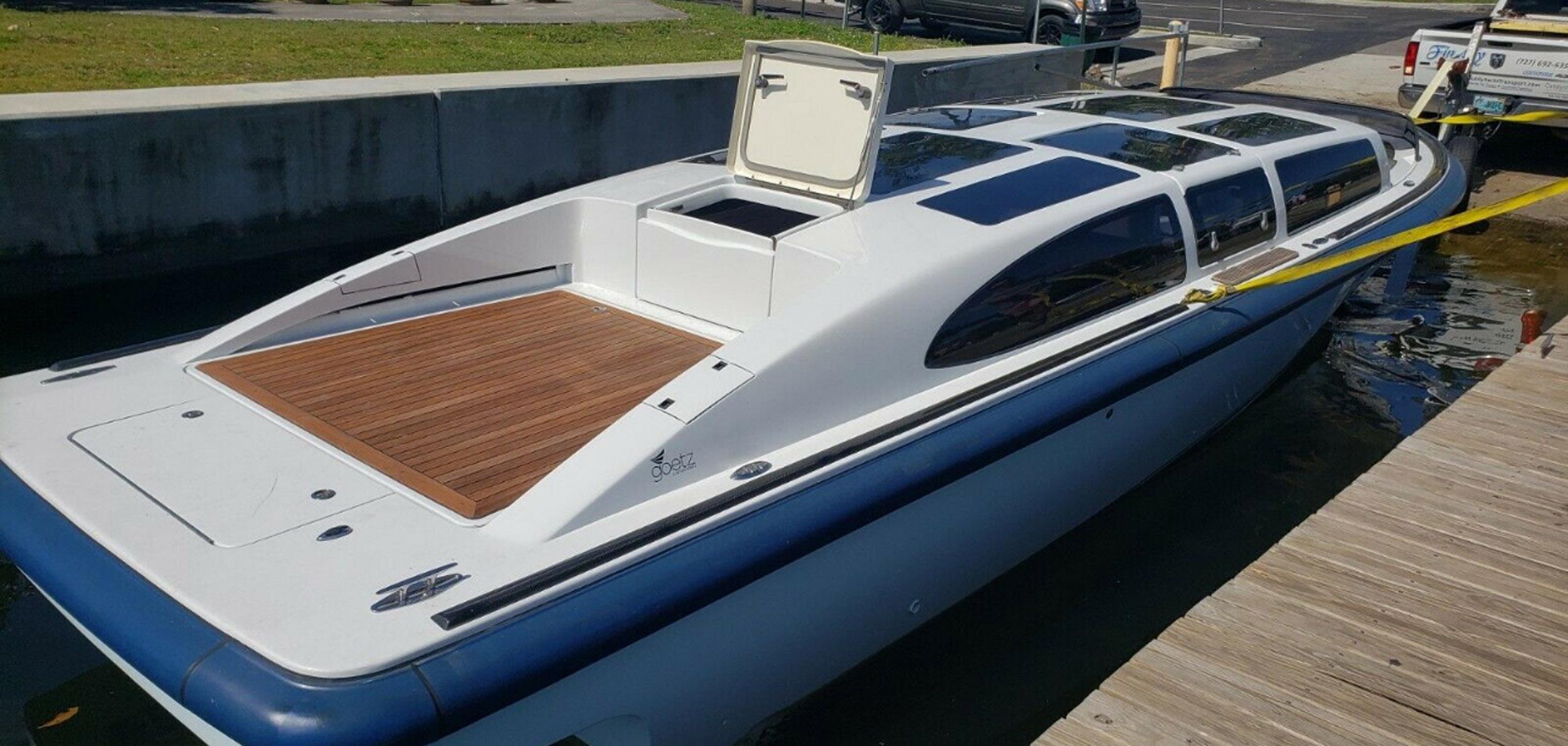 2008 Goetz Custom Boats 33' Limo Tender docked, featuring sleek design and spacious deck.