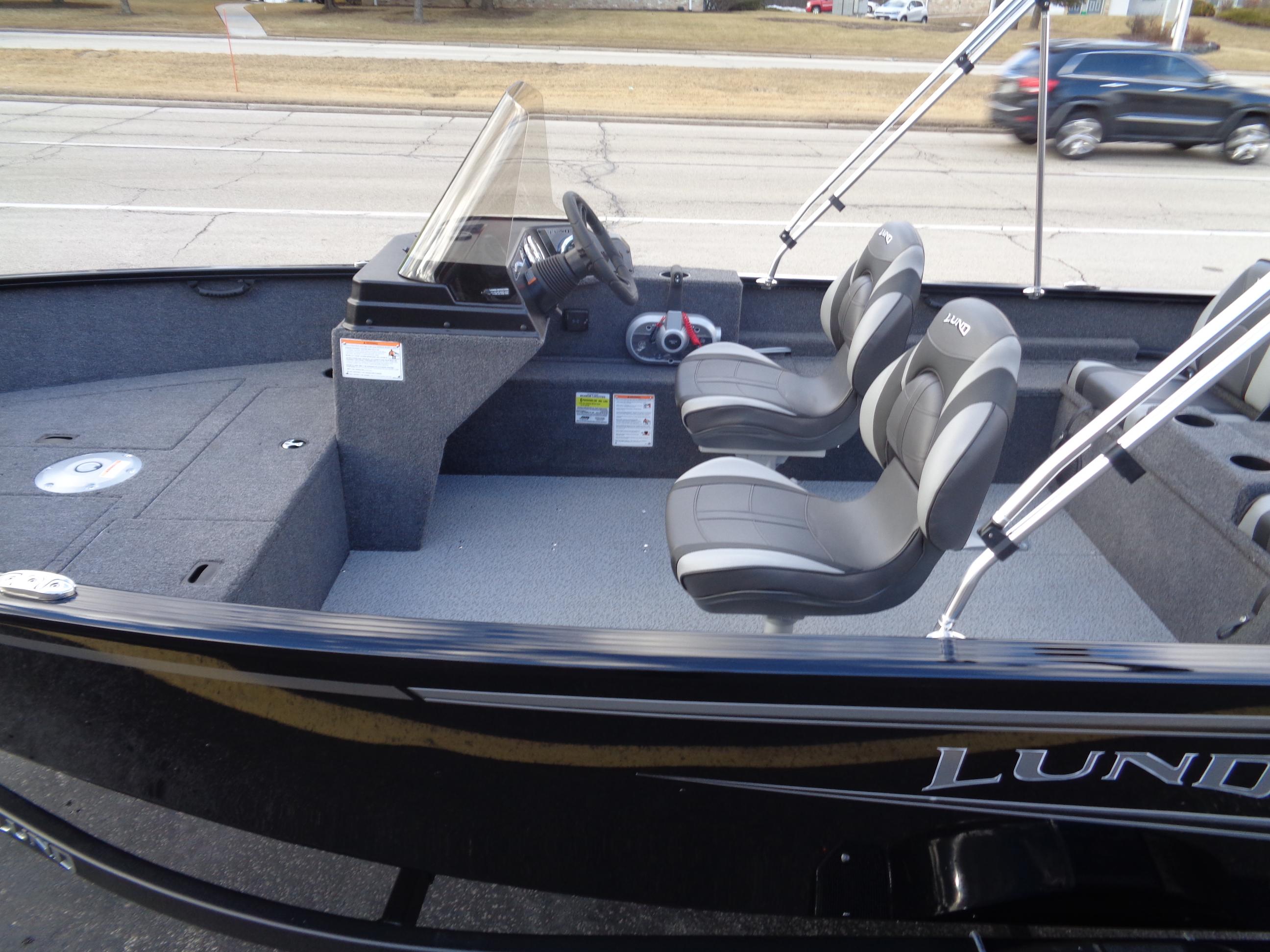 2025 Lund 1650 Rebel XL SS boat interior with dual seats and steering console.