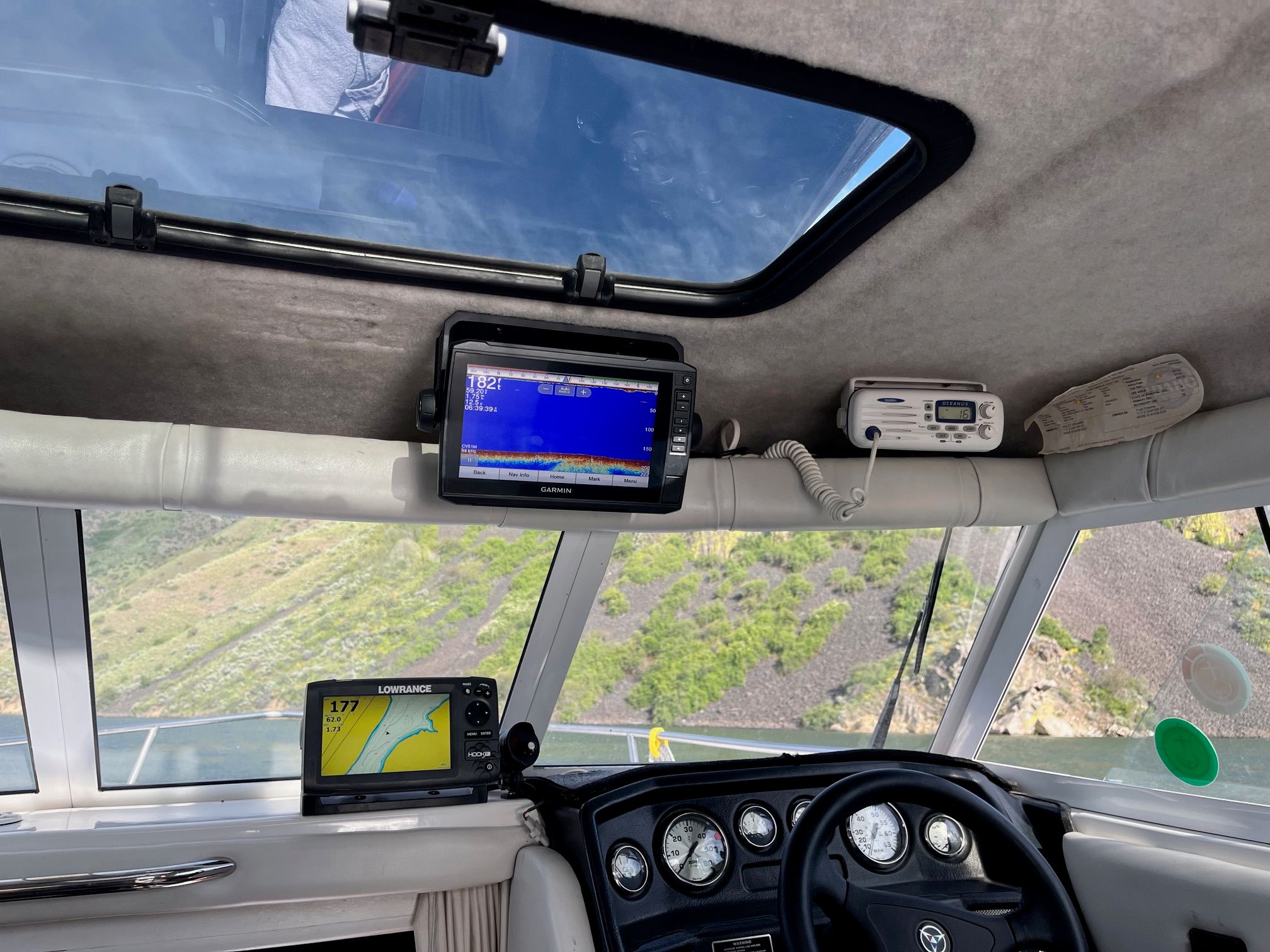 Interior of a 2002 Campion 622 Explorer boat with navigation equipment and steering wheel.