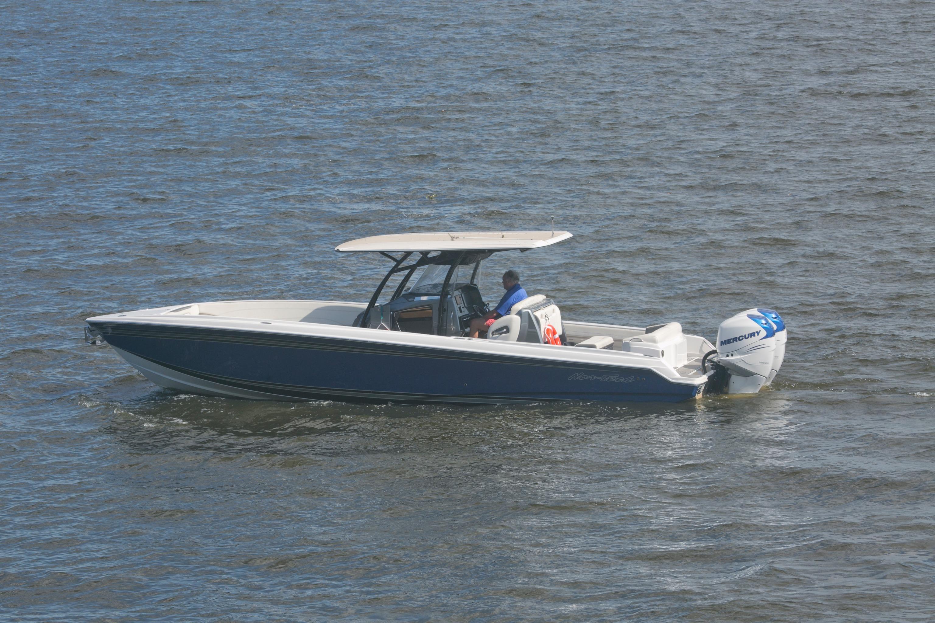 2018 Nor-Tech 340 Sport Center Console boat cruising on open water.