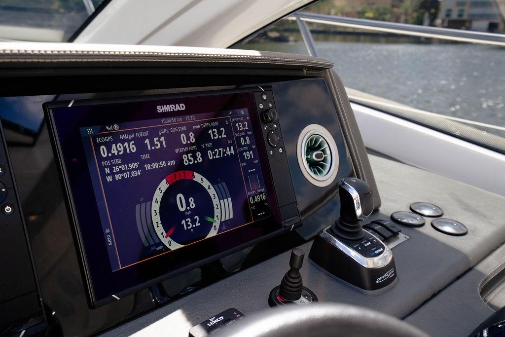 Dashboard of 2022 Schaefer 400 Sport yacht with Simrad navigation display.