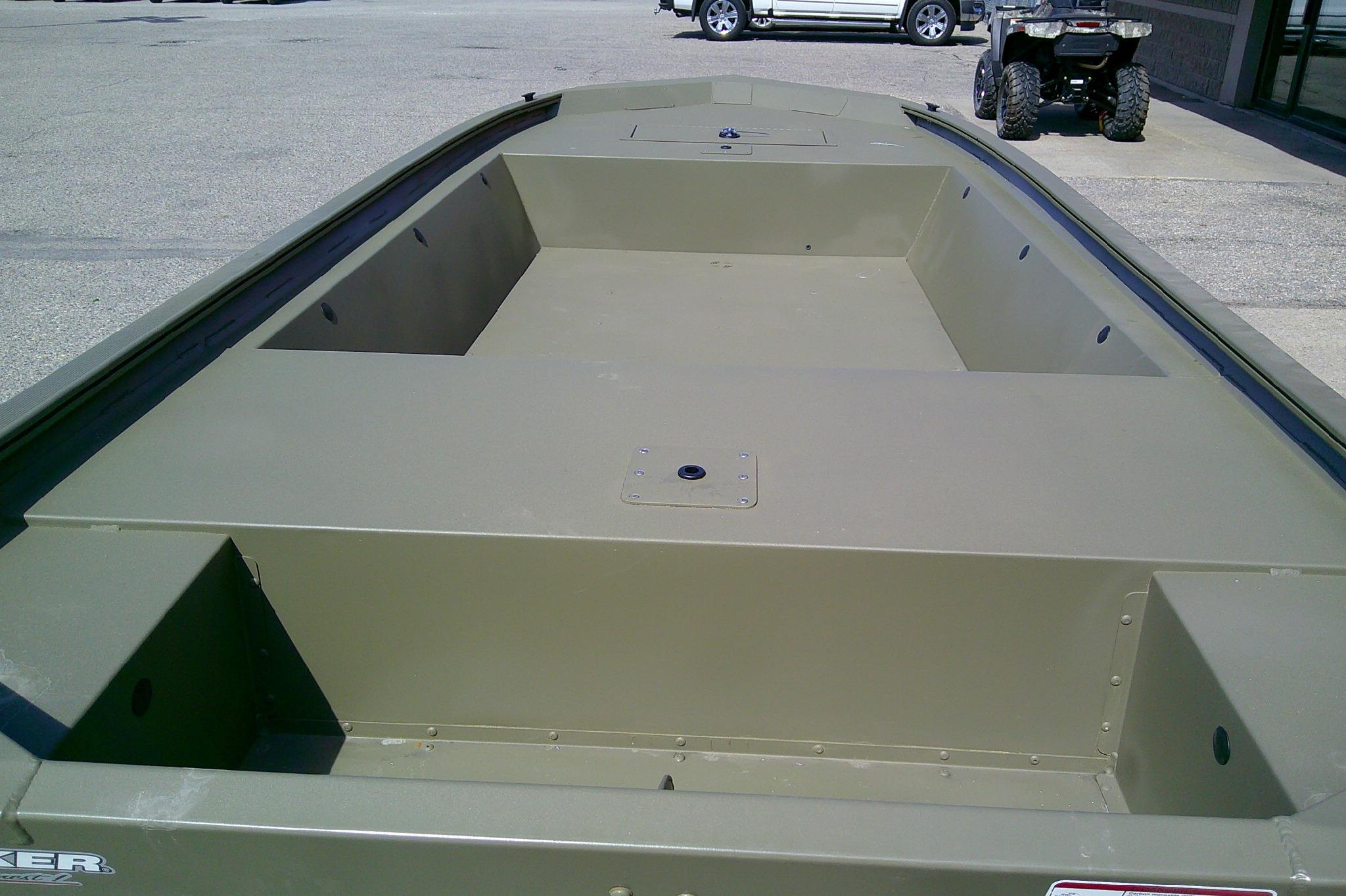 2026 Tracker Grizzly 1648 Utility boat, olive green, parked outdoors.