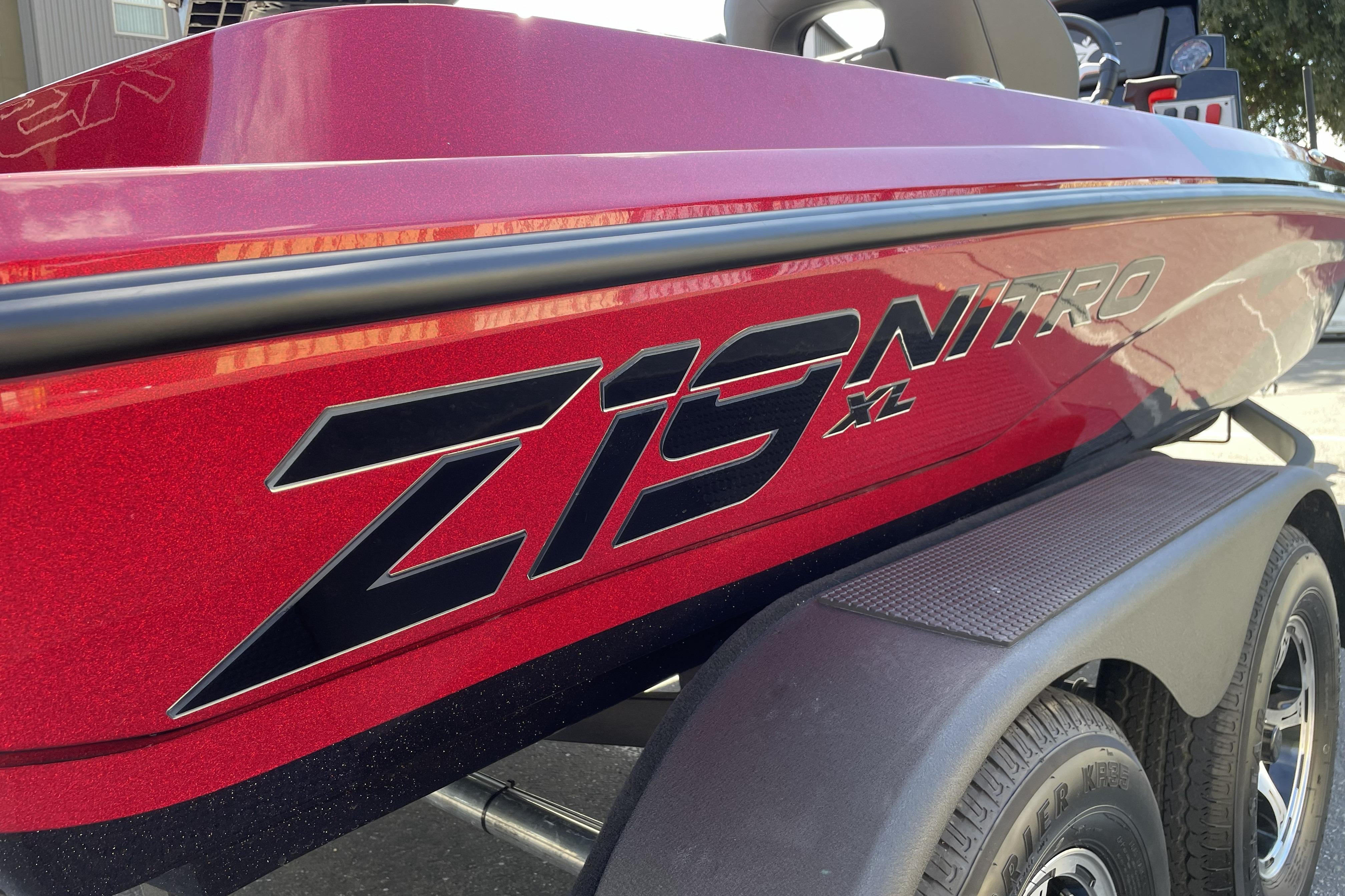 2026 Nitro Z19 XL boat, red exterior with bold branding, on a trailer.