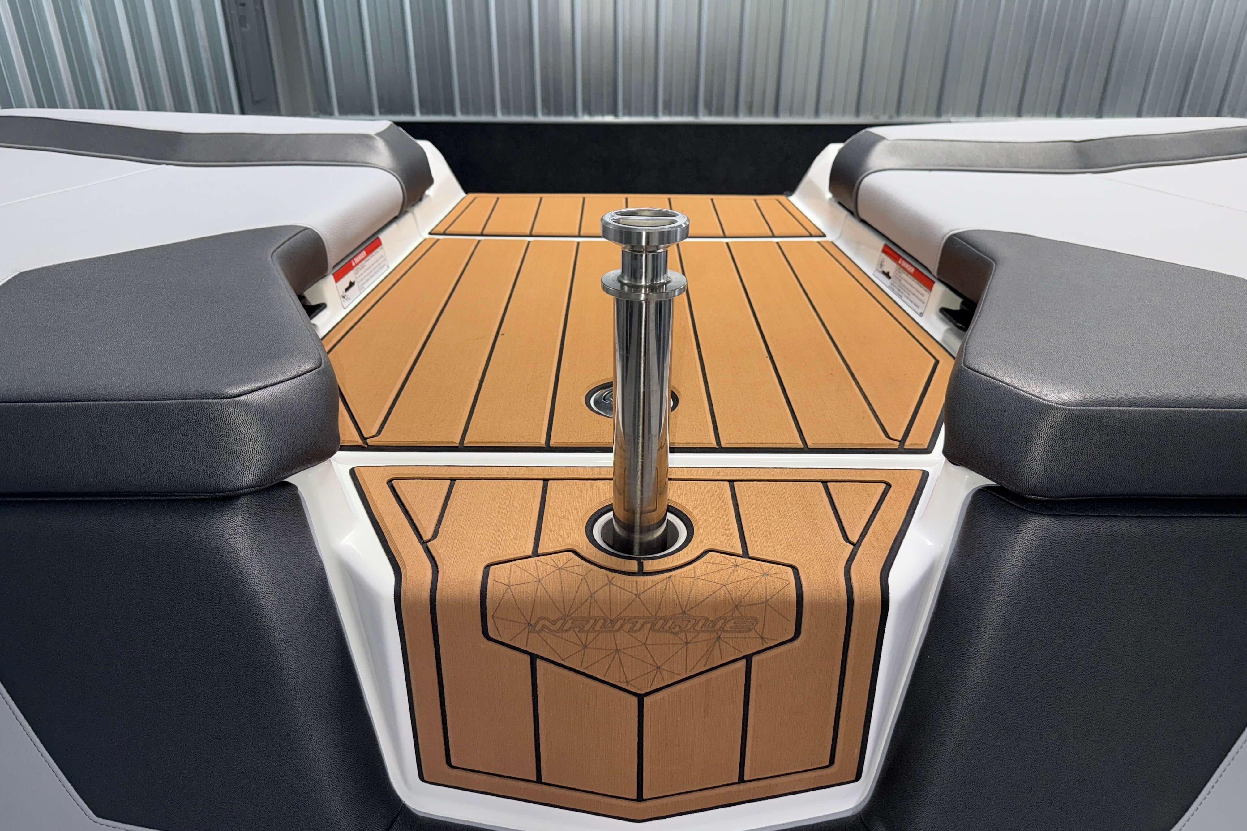 2026 Nautique Super Air Nautique GS22 boat interior with teak deck and cushioned seating.